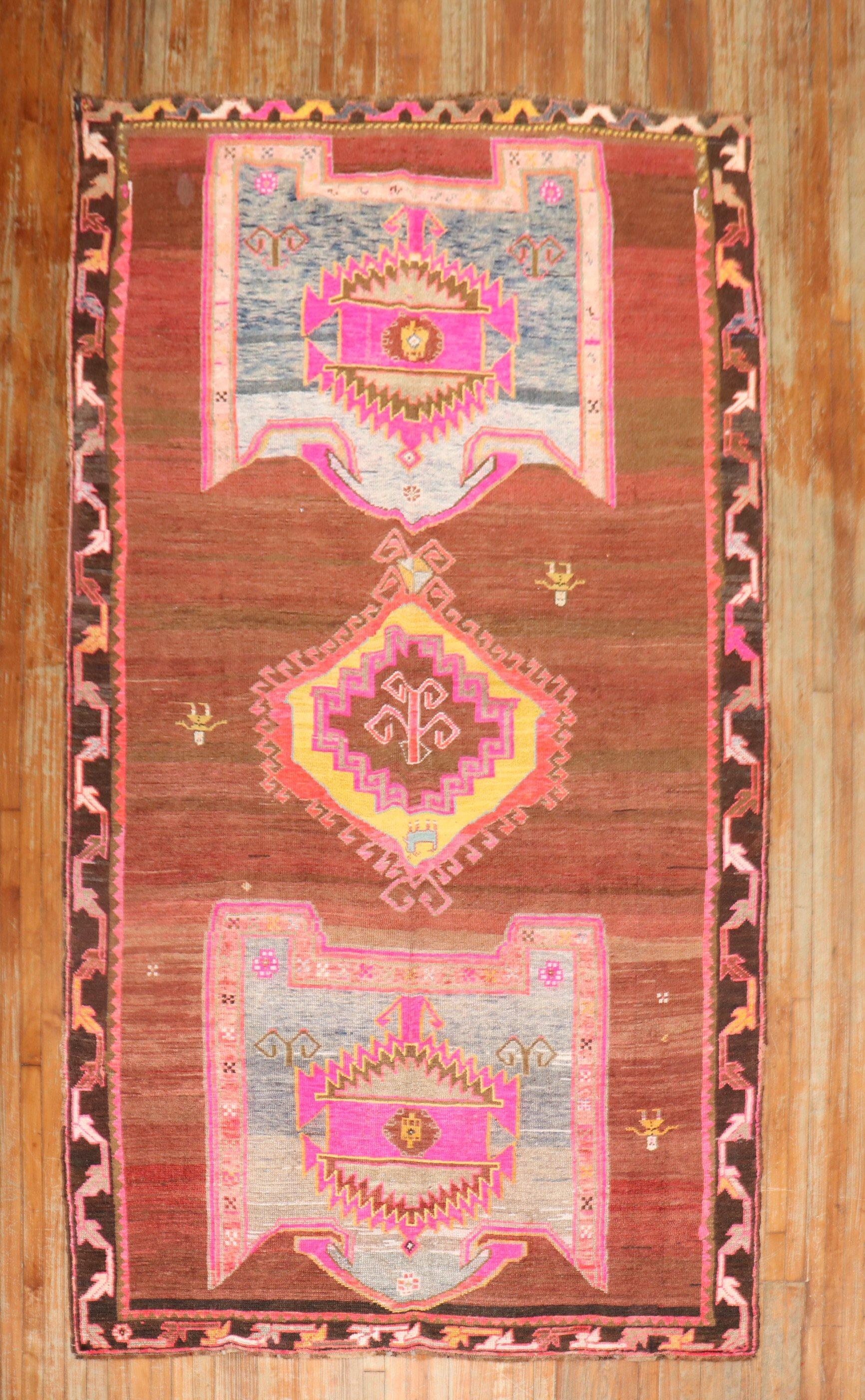 A Mid 20th century Turkish Kars Gallery size Rug in bright jazzy colors. Look at the 3 people floating around too!!

Details
rug no.	j2851
size	6' 3