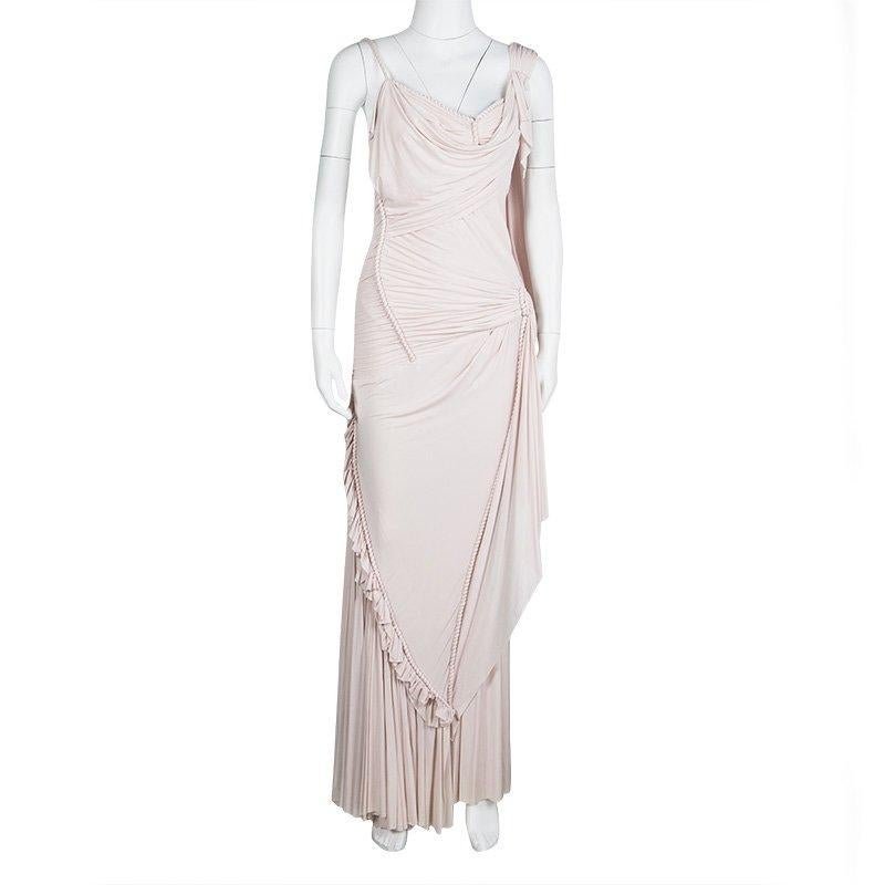 The quest for the perfect gown ends with this sleeveless number from Zac Posen. The dress is feminine and classy, with just the perfect accents one needs in an elegant outfit. Designed in a fitted silhouette, the dress carries drapings and cord