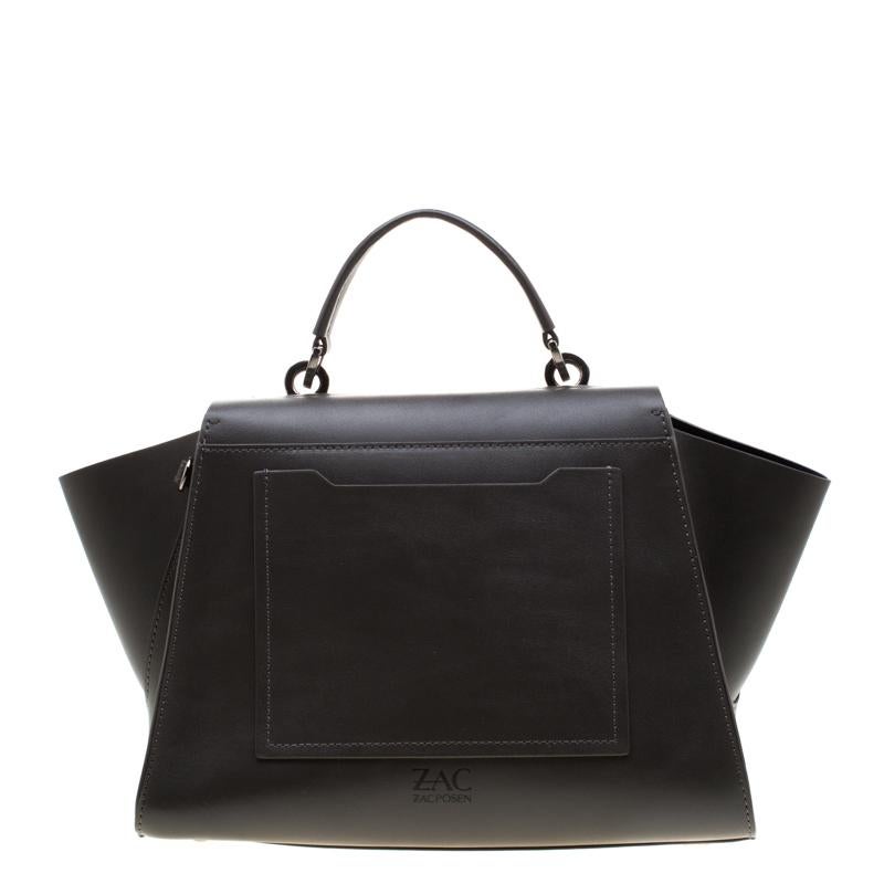 Look stunning while swinging this magnificent leather bag. One cannot go wrong with a beauty such as this one. It has a flap style, a top handle, winged gussets, and a spacious interior. Fall in love instantly with this gorgeous handbag by Zac