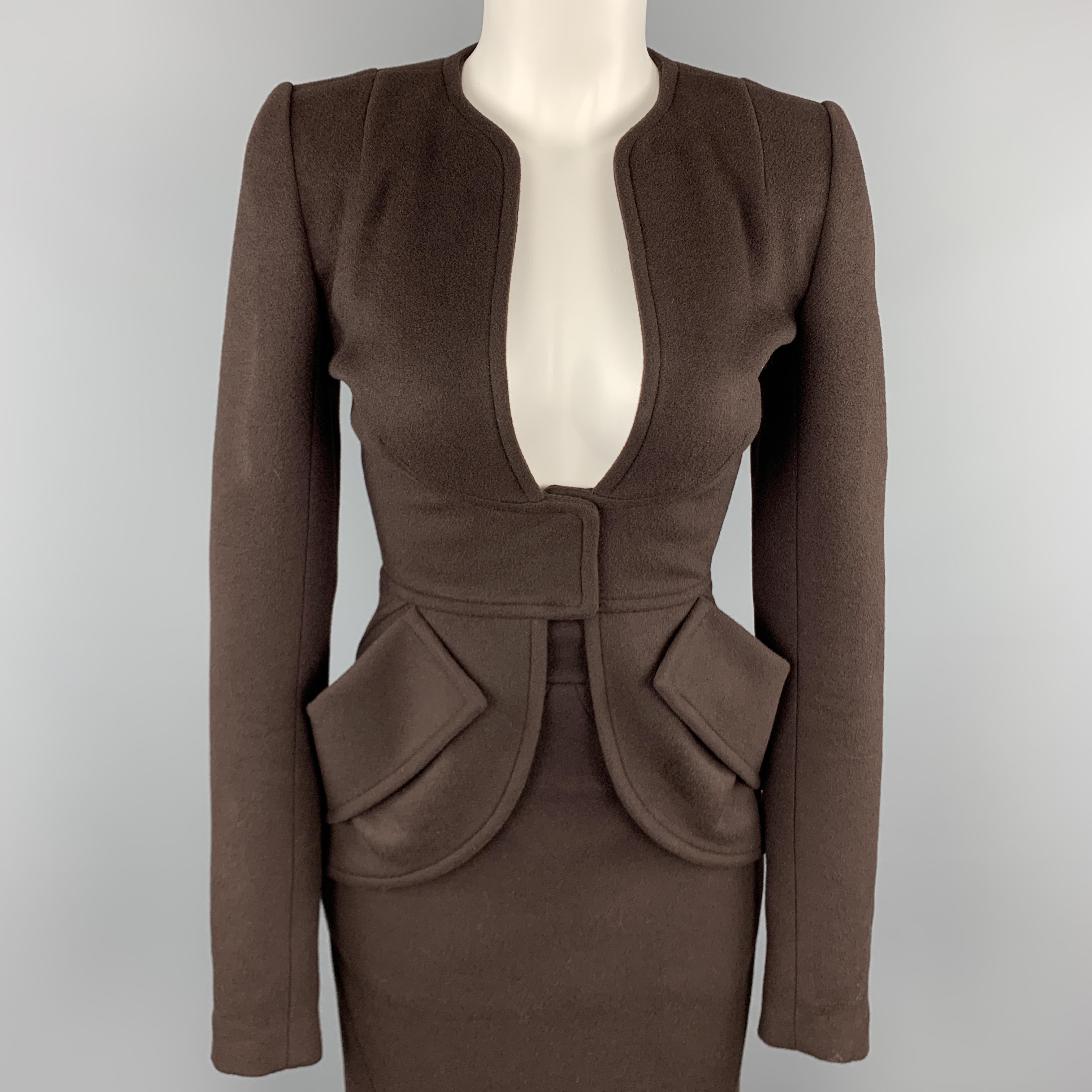 ZAC POSEN 1940's inspired suit comes in brown felt and includes a collarless, plunge neck jacket and matching fishtail back midi pencil skirt. Made in USA.

Very Good Pre-Owned Condition.
Marked: 2 in.

Measurements:

-Jacket
Shoulder: 14 in.
Bust: