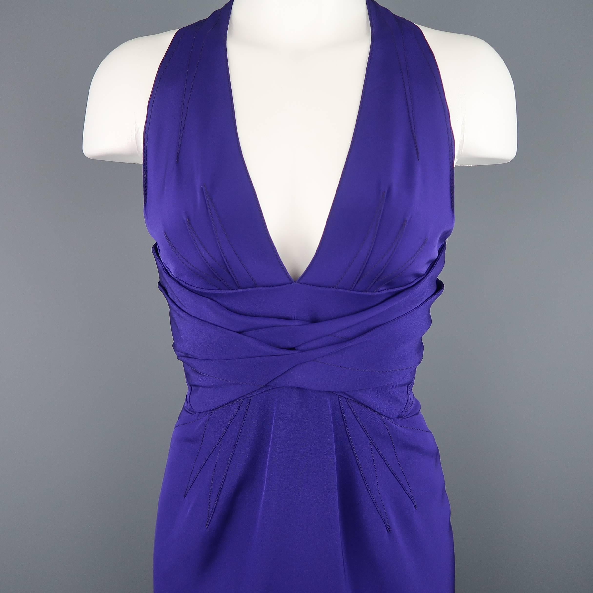 ZAC POSEN cocktail dress comes in a purple stretch silk with a deep V neck halter top, gathered sash underbust, fitted skirt, and dart details throughout.
 
Excellent Pre-Owned Condition.
Marked: 2
 
Measurements:
 
Shoulder: 9.5 in.
Bust: 34