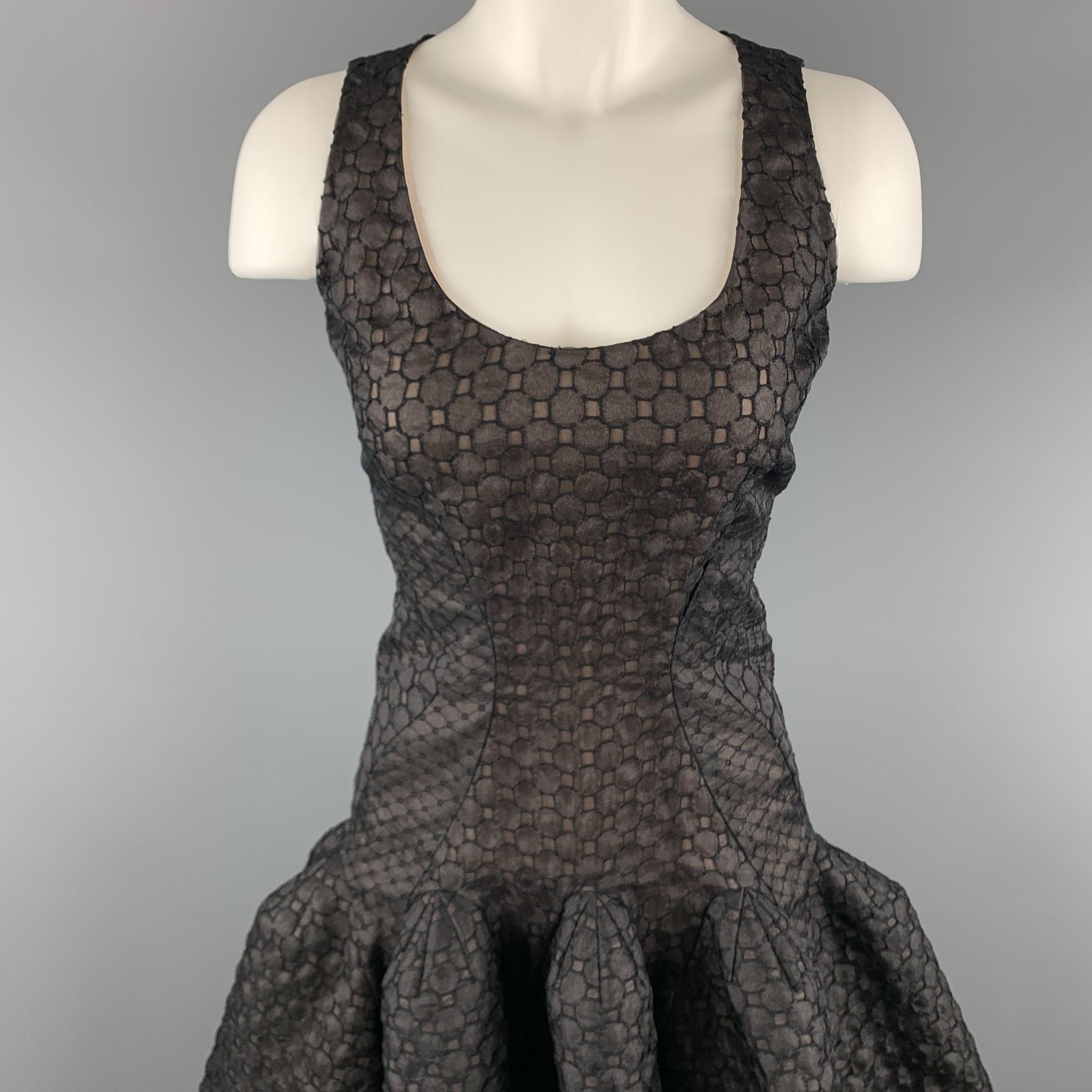 ZAC POSEN cocktail dress comes in black lace with a beige liner and features a scoop neckline, sleeveless thick strap bodice top, fitted body, and structured ruffle cropped trumpet skirt. Made in USA.

Excellent Pre-Owned Condition.
Marked:
