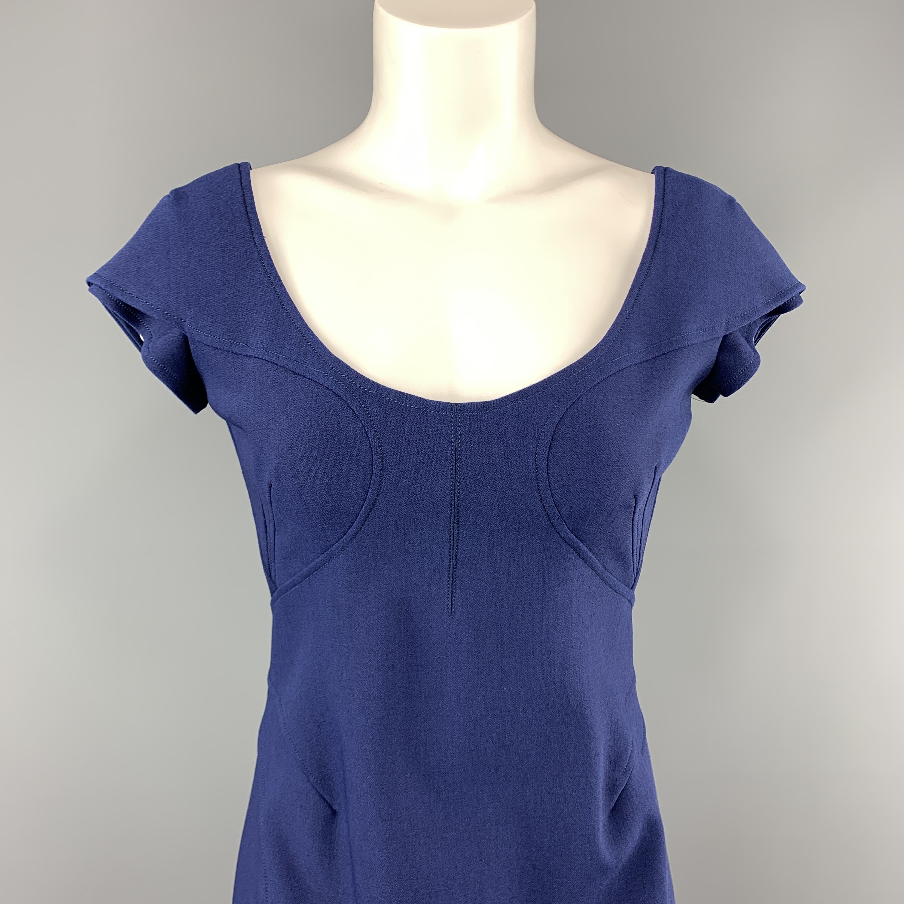 ZAC POSEN sheath dress comes in navy blue stretch wool with a scoop neck, layered cap sleeves, detailed bust, and hidden back zip.
 
Excellent Pre-Owned Condition.
Marked: 6
 
Measurements:
 
Shoulder: 15 in.
Bust: 36 in.
Waist: 28 in.
Hip: 36