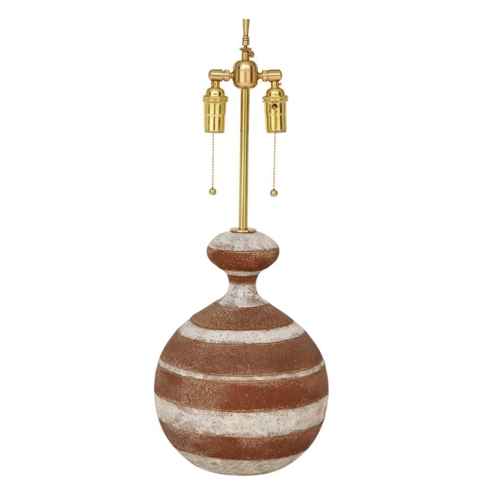 Zaccagnini lamp, ceramic, white and terracotta stripes, signed. Medium scale gourd form table lamp with white glazed stripes alternating over terracotta. Signed on the underside of the lamp base: Z Italy. Height of the ceramic only - 15 inches.