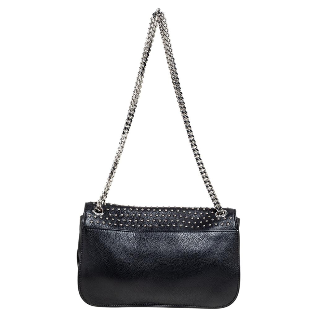 Meticulously crafted using leather, this bag by Zadig & Voltaire features an appealing look. It has stud embellishments all over, a shoulder strap, and a well-sized interior.

Includes: Original Dustbag