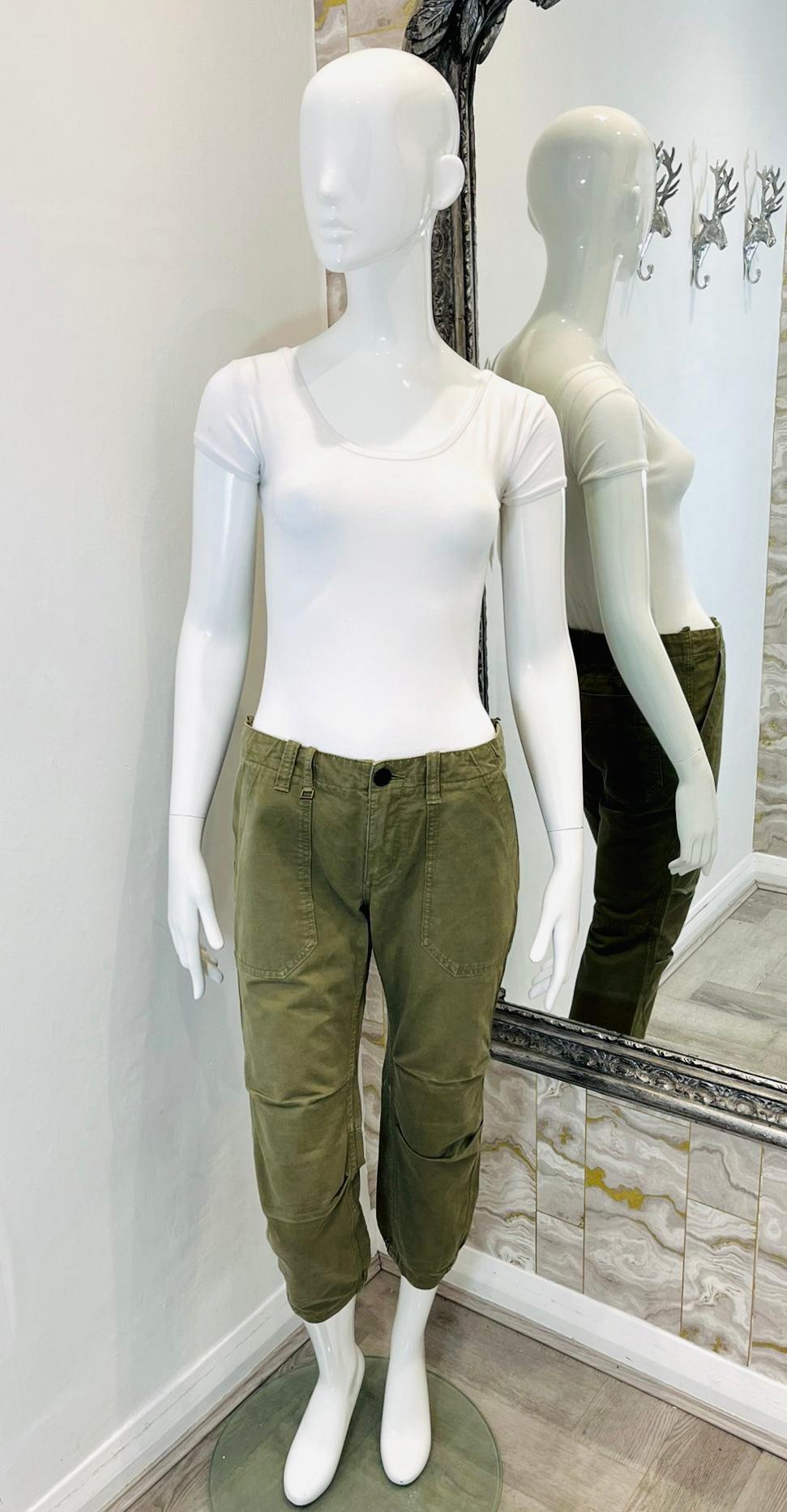 Zadig & Voltaire Cropped Cotton Trousers

Khaki, military styled trousers designed with cropped leg and elasticated cuffs.

Featuring belt loops, side and rear pockets and zip and button closure.

Size – 36FR

Condition – Good (Abrasions on the