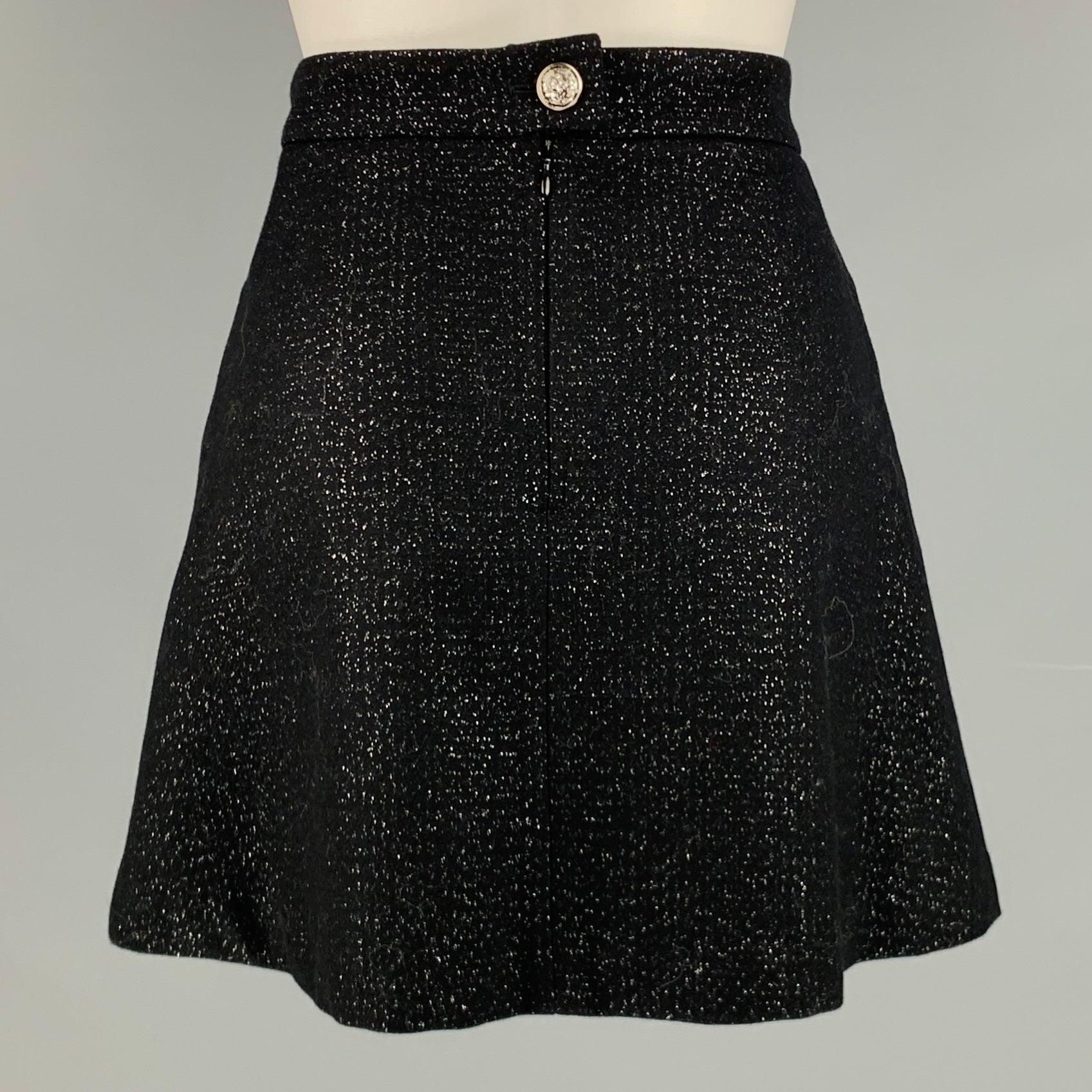 ZADIG & VOLTAIRE skirt
in a black wool blend featuring a mini length, silver tone metallic details throughout, two pockets, and back zipper closure. Made in Romania.Excellent Pre-Owned Condition. 

Marked:   6 

Measurements: 
  Waist: 27
 inches