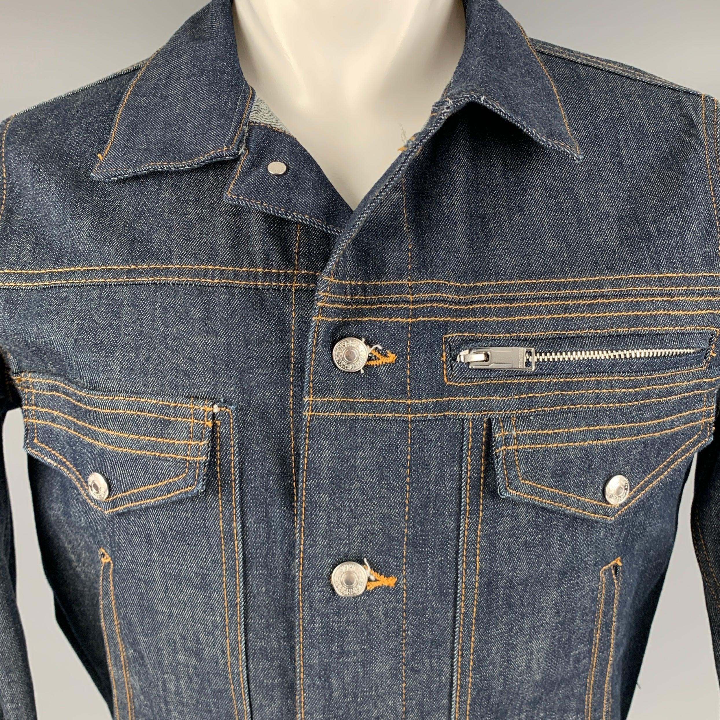 ZADIG & VOLTAIRE jacket
in an indigo cotton blend denim featuring a trucker style, yellow contrast stitching, five utilitarian pockets, and button closure.Excellent Pre-Owned Condition. 

Marked:   S 

Measurements: 
 
Shoulder: 16.5 inches Chest:
