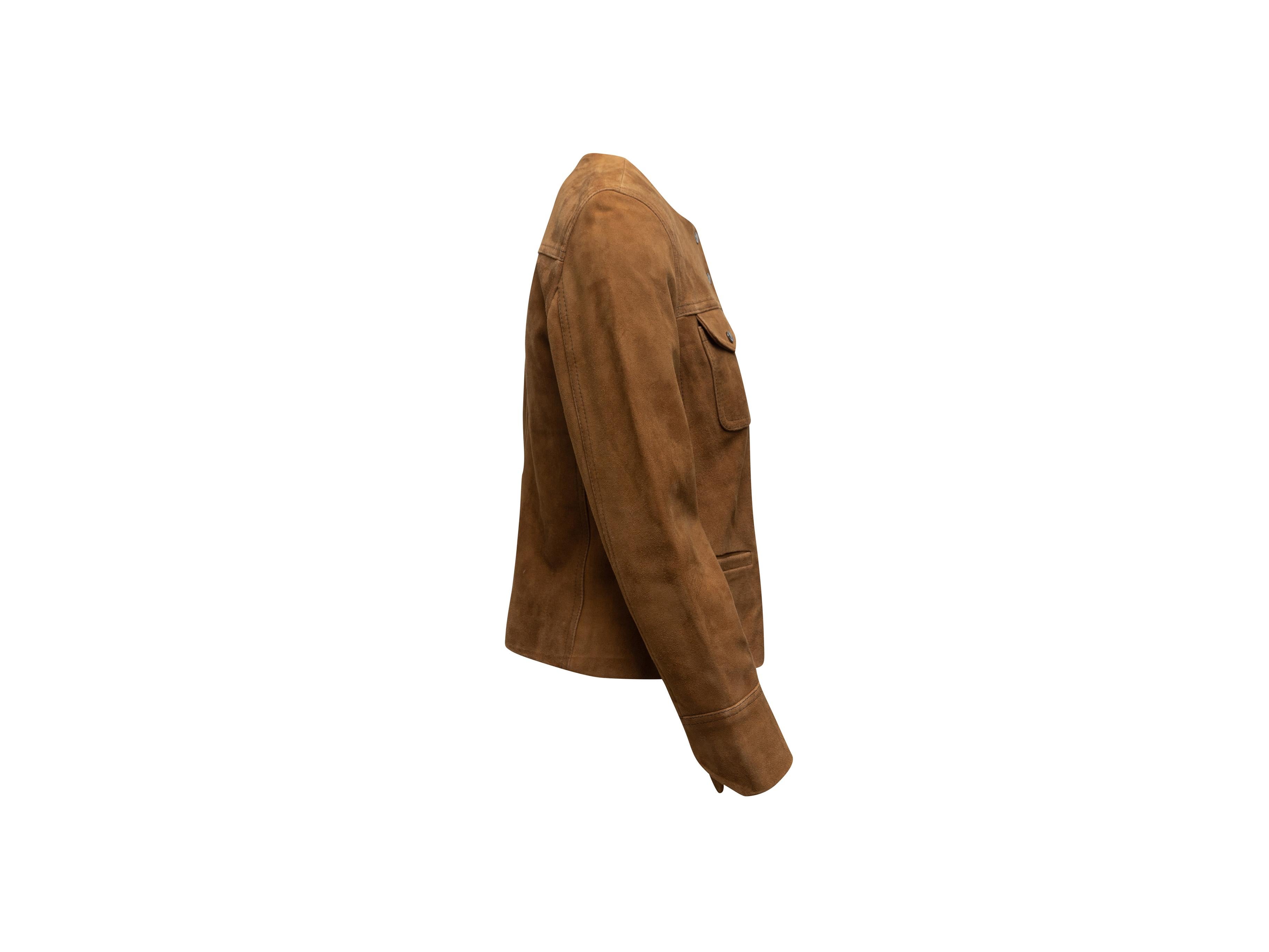 Product details: Tan suede collarless jacket by Zadig & Voltaire. Crew neck. Dual flap pockets at bust. Dual welt pockets at hips. Snap closures at center front. 15