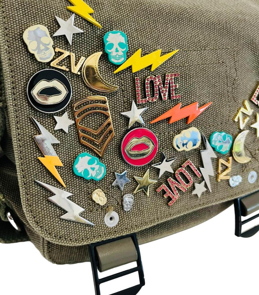 Zadig & Voltaire XS Ready Made Canvas Messenger Bag

Khaki military-style messenger bag decorated with multicoloured 'love', lightning bolts and skulls.

Detailed with silver chain strap that can be worn on the shoulder or left hanging at the