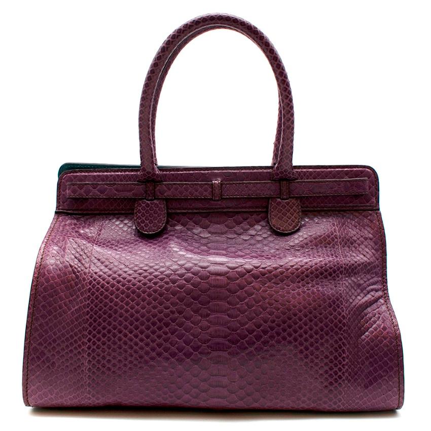 Zagliani Purple Python Skin Top Handle Bag

The Milanese fashion house Zagliani was founded in 1947 and is known for its quest for absolute perfection. It has always been appreciated by women for its handmade handbags. Zagliani uses only the finest