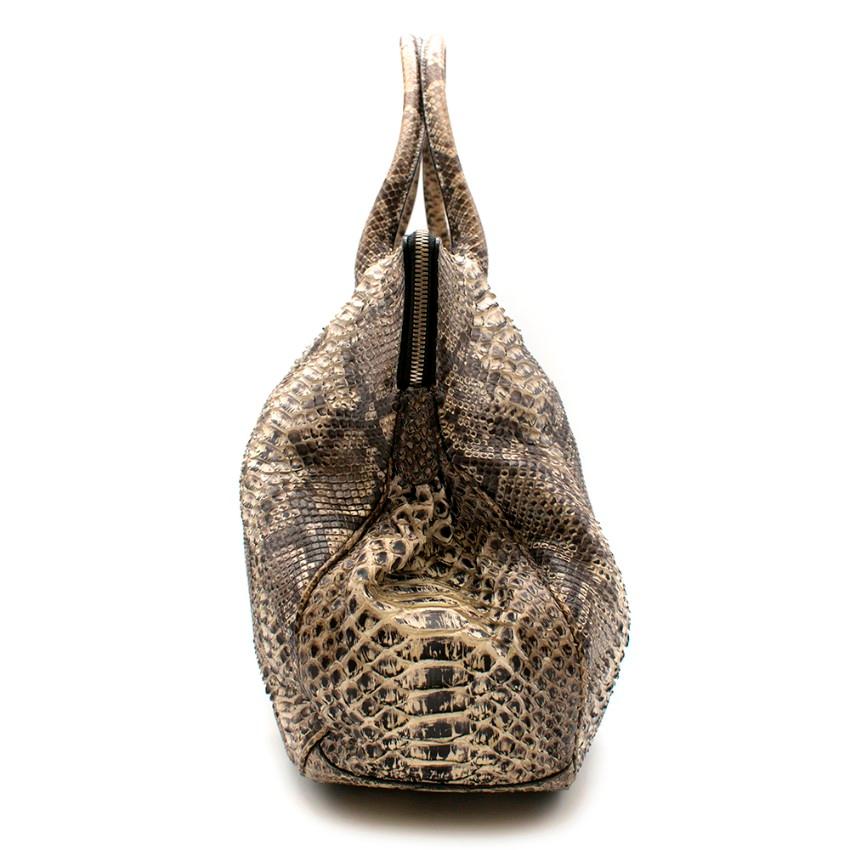 Zagliani Python Leather Tote Handbag

- Large overnight bag size
- Exposed metal hardware zip
- Purple suede interior
- Internal zip up pocket
- Two internal side pouches
- Stiff handles

Material
- Purple suede lining 
- Python leather 

Made in