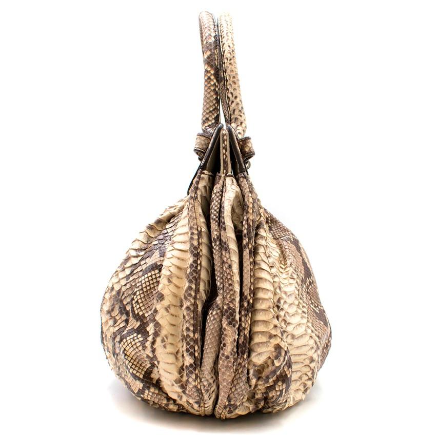 Zagliani Python Roccia Bag

- Beige and brown Python leather all over
- 2 top handles
- Silver-tone turn-lock to fasten
- Suede beige lining
- 2 main interior compartments
- 1 inside Python-trimmed pocket
- Large exposed zipper pocket 

Please note,