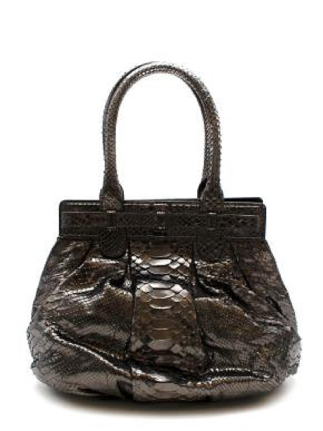 Zagliani Gunmetal Python Tote

- gunmetal tone python body
- round style
-turnlock closure

Condition 9/10. Great vintage condition

PLEASE NOTE, THESE ITEMS ARE PRE-OWNED AND MAY SHOW SIGNS OF BEING STORED EVEN WHEN UNWORN AND UNUSED. THIS IS
