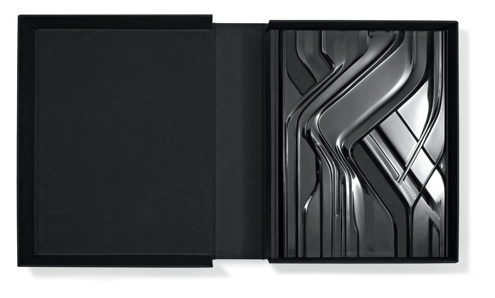 Exceptional Zaha Hadid-signed and designed Art Edition of her complete works from Taschen in 2009. A 600-page XL-oversized book covered by a three dimensional custom made cast and high gloss polish black acrylic cover designed by Hadid and inspired