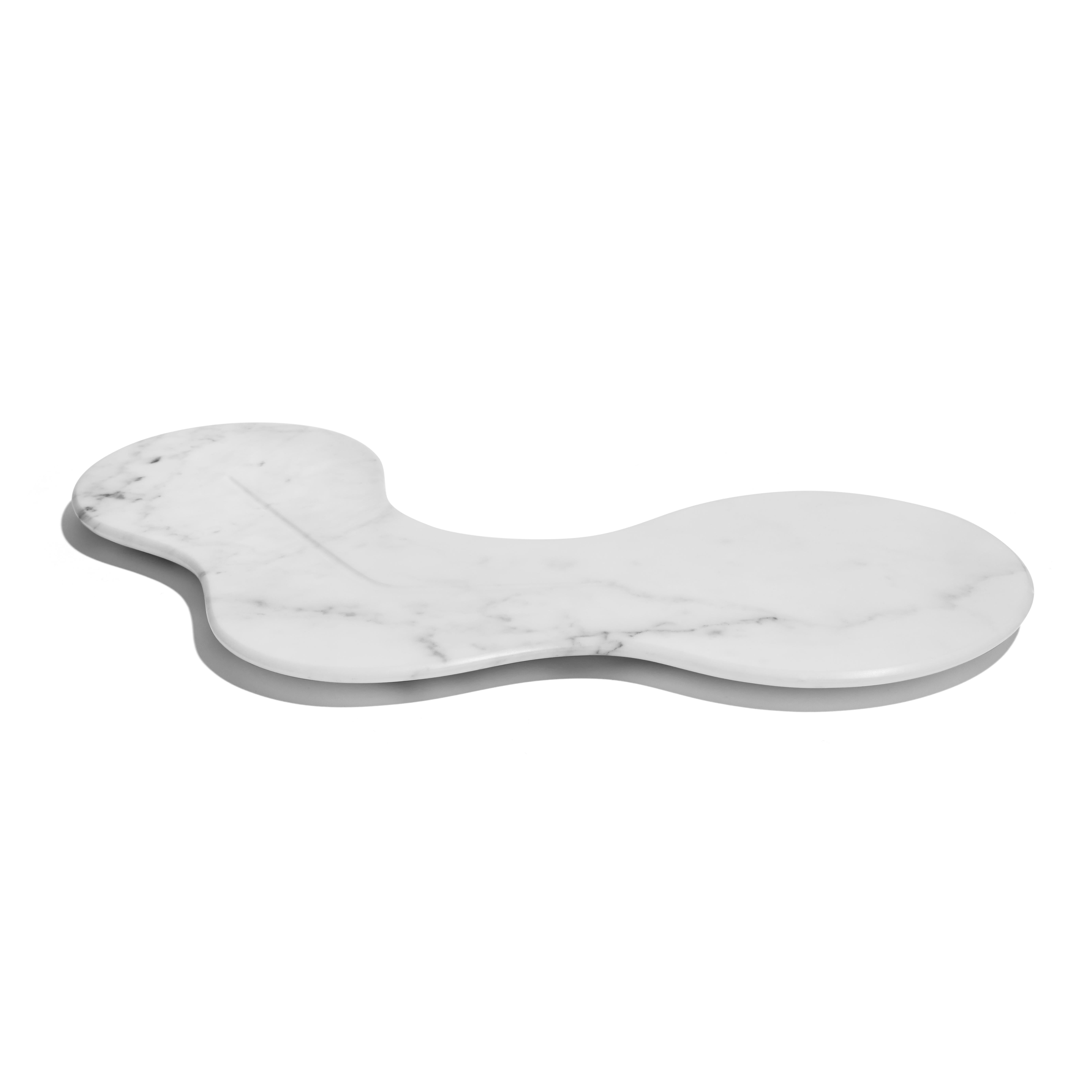 By Zaha Hadid Design

The Cell Platter was inspired by the replication and growth of cellular organisms. It is available in honed marble, has a subtle surface indentation to allow what is placed on it to nestle seamlessly on the surface. 

The