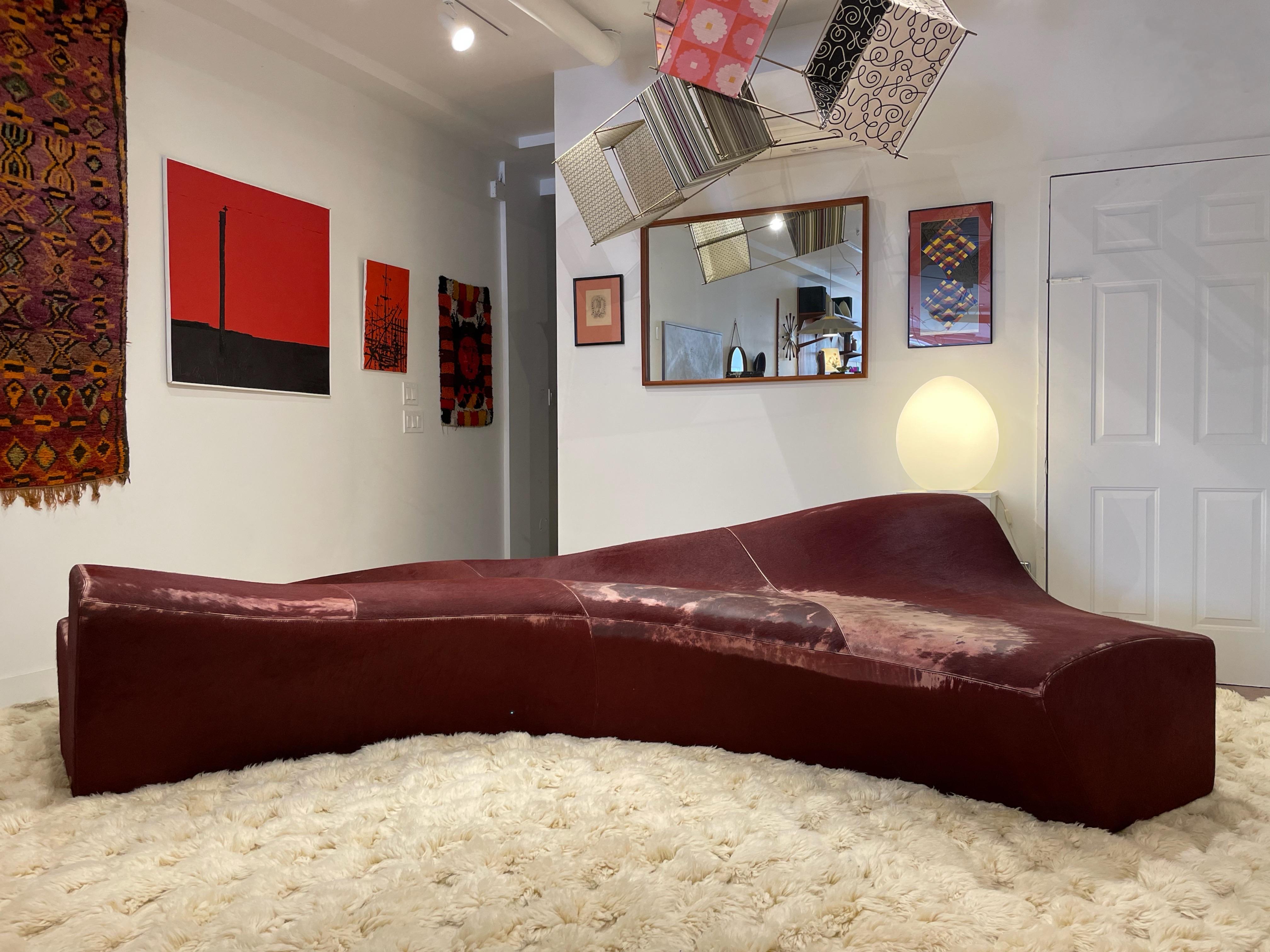Out of this world piece by iconic British-Iraqi architect Zaha Hadid. The Moraine sofa was designed in 2000, and produced by Sawaya & Moroni of Italy. Organic curves wrapped in merlot pony ‘fantasy leather’, a specialty hide produced by Sawaya &