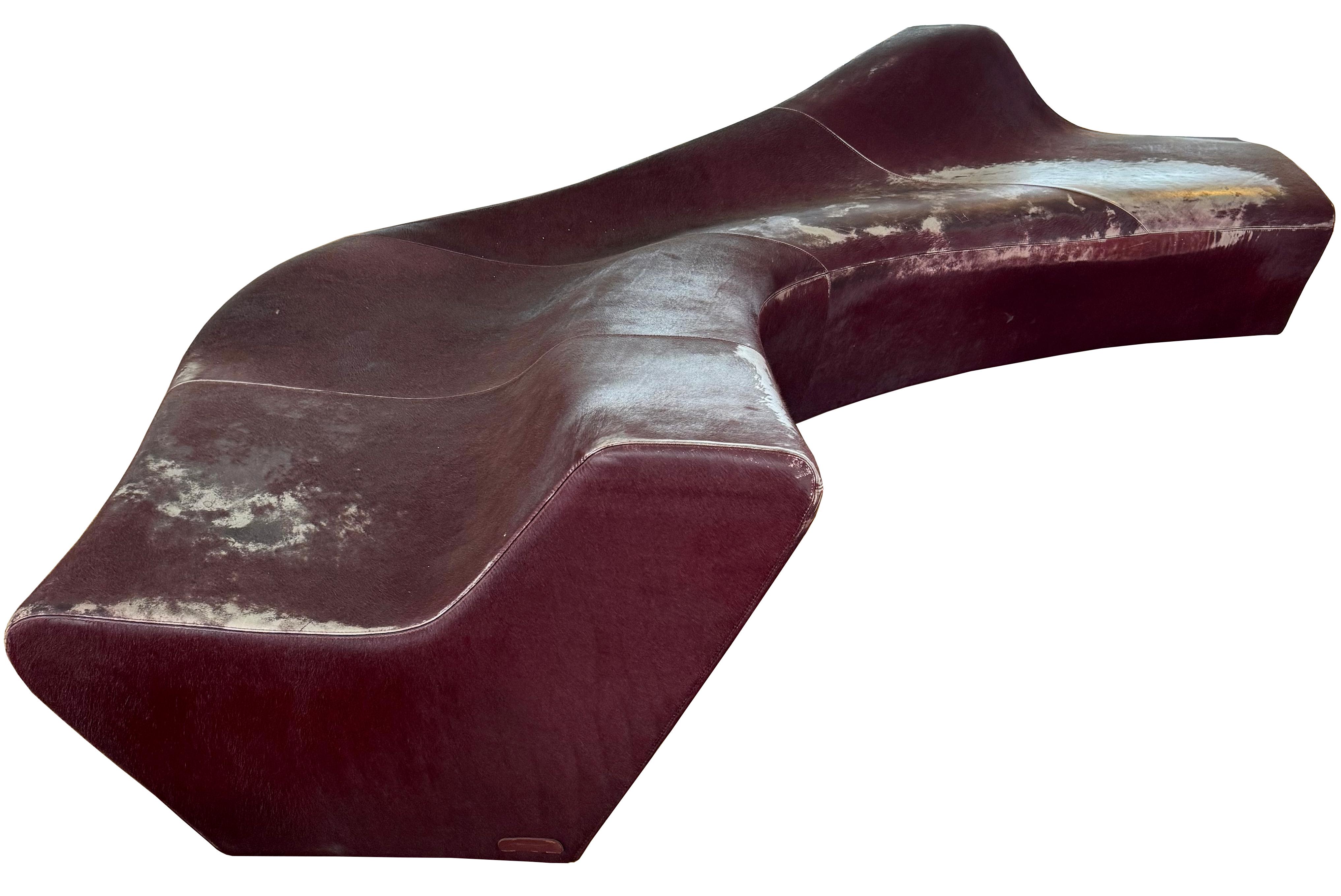 Out of this world piece by iconic British-Iraqi architect Zaha Hadid. 
The Moraine sofa was designed in 2000, and produced by Sawaya & Moroni of Italy. Organic curves wrapped in merlot pony ‘fantasy leather’, a specialty hide produced by Sawaya &