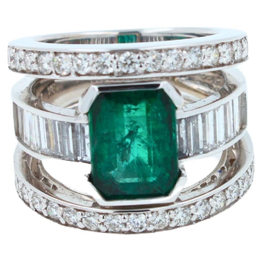 Art Deco Zambian Emerald 18 Karat White Gold Full Finger Bezel Diamond Baguette Rows Ring For Sale
