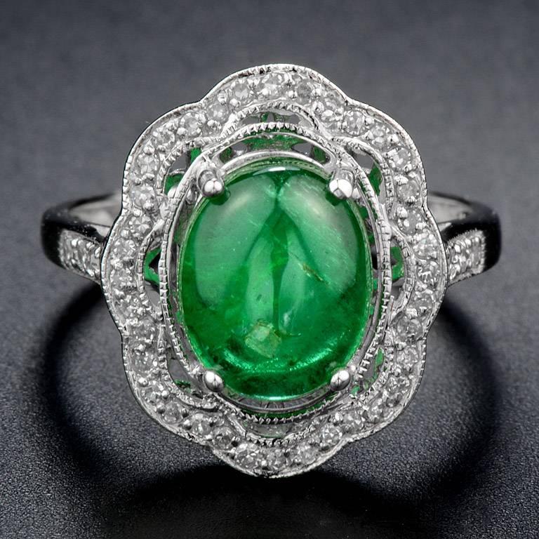 Cabochon Emerald From Zambia 2.75 Carat with Single Cut Diamond (F/VS) 42 pieces 0.20 Carat on 18K White Gold Ring.  This Ring was made in size US#7 