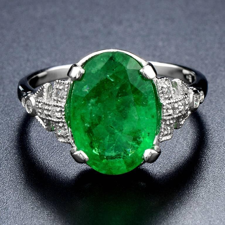 The luxurious 18k White Gold featured a Zambian Emerald Oval Shape 3.83 Carat in the center with Brilliant Cut Diamond 12 pieces 0.13 Carat.

This ring was made in size US#7