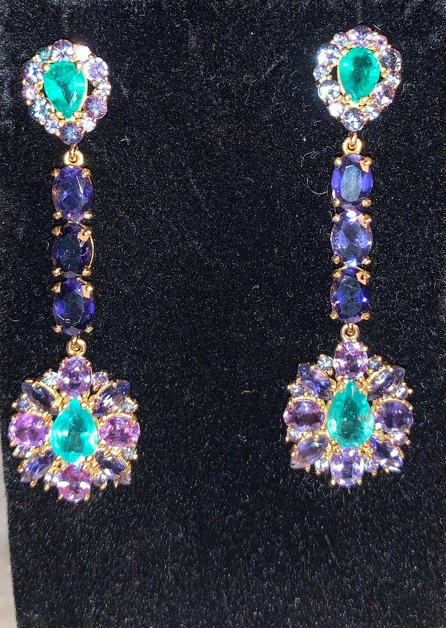 Sabrina Balsky Jewelry
One of a Kind Zambian Blue Green Emerald Earrings bordered with 28 2mm Alexandrites and 12 3mm Alexandrites and  Purple Sapphires, joined with Faceted Iolites set in 18kt yellow gold.
Very Rare Russian Alexandrite stones