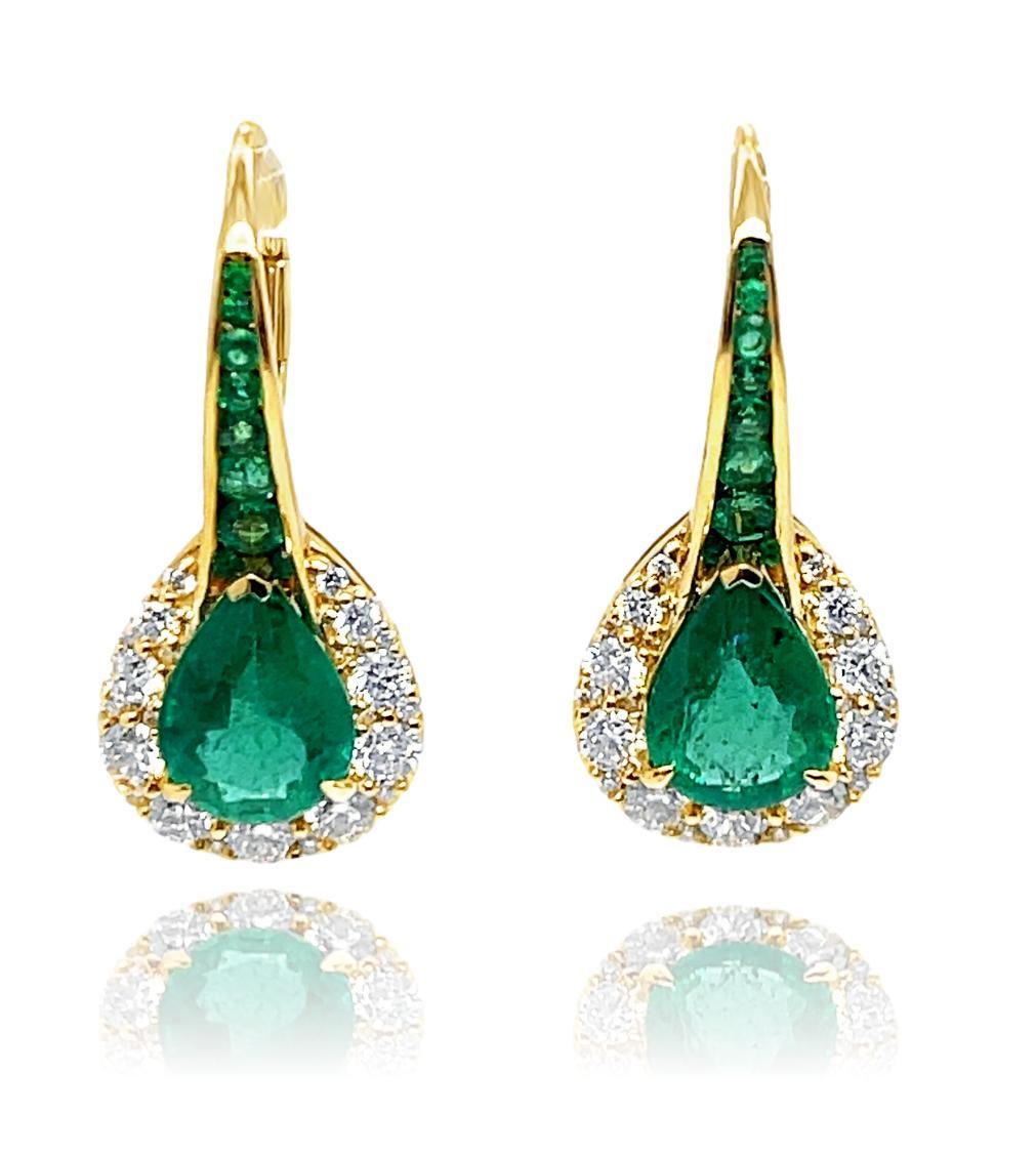 These stunning natural Teardrop Emerald and Diamond dangling hoop earrings are a beautiful accessory for your special event. These earrings have two 9x7 mm pear shape Zambian Emeralds center with a row of emerald rounds above the center stone. There