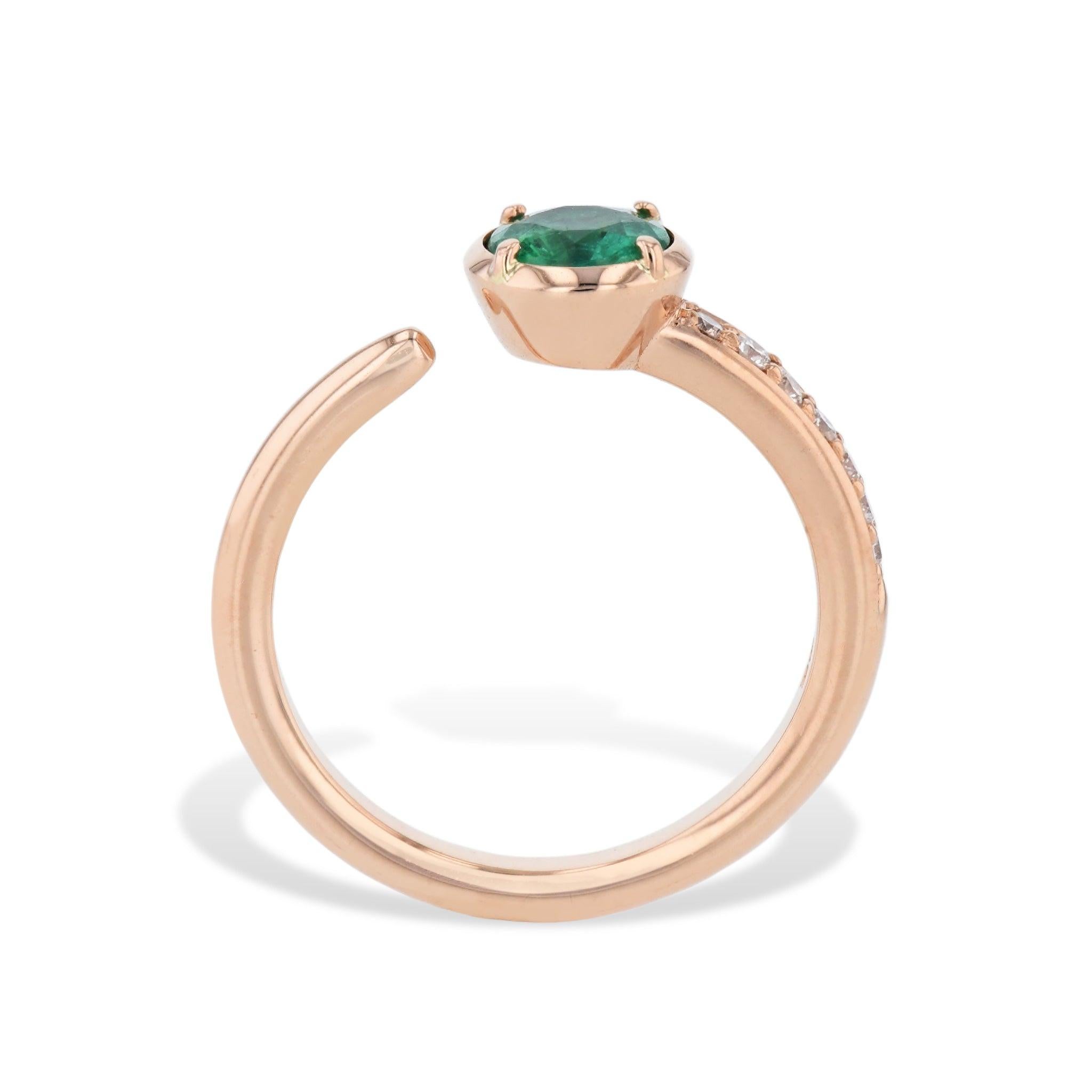 Indulge in the effortless beauty of our Zambian Emerald and Pave Diamond Open Ring. Crafted from 18 karat rose gold, this dazzling piece features a round Zambian emerald paired with pave diamonds. Pave-mounted diamonds on one side of the shank and