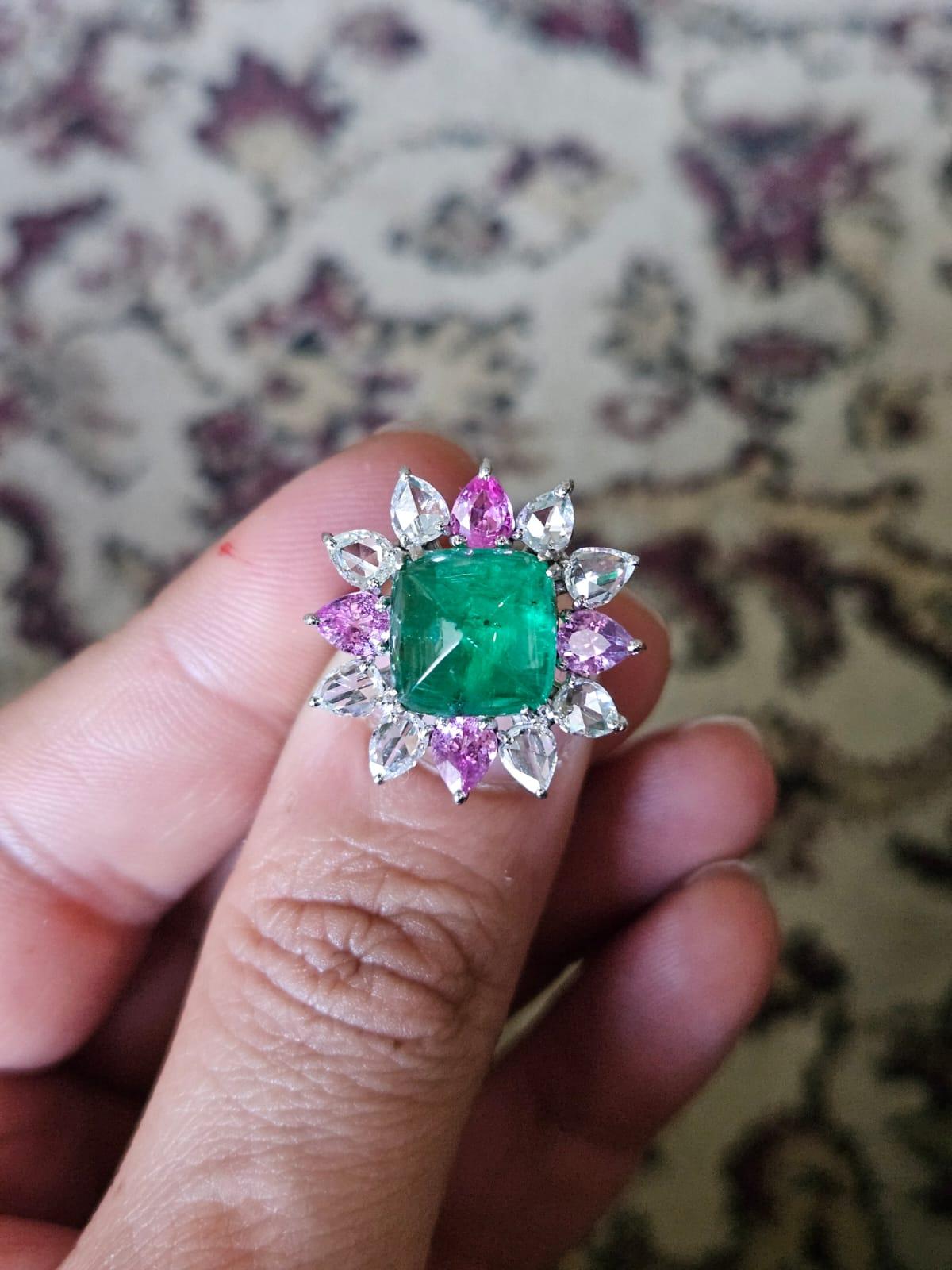 A very beautiful and gorgeous, Art deco style, Emerald & Pink Sapphire Cocktail Engagement Ring set in 18K White Gold & Diamonds. The weight of the Emerald Sugarloaf Cabochon is 4.82 carats. The Emerald is completely natural, without any treatment