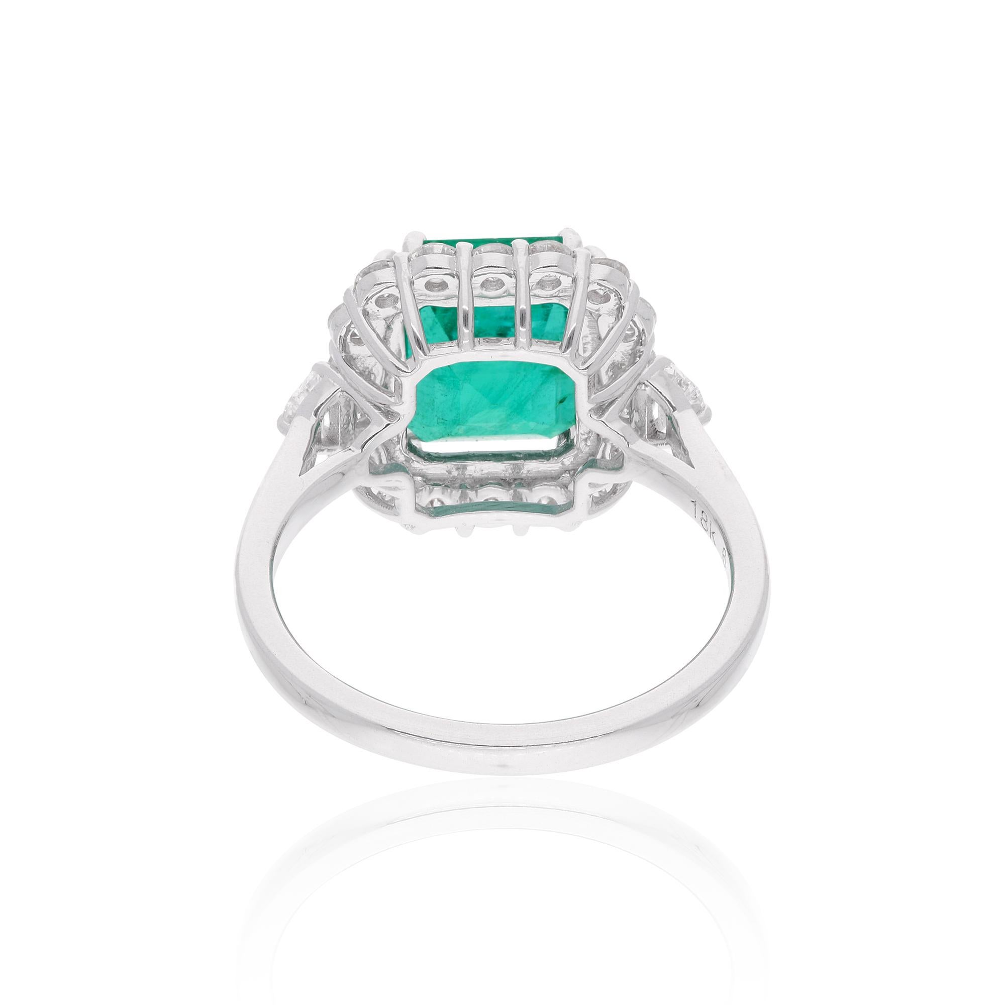 Elevate your jewelry collection with this exquisite Zambian Emerald Cocktail Ring. The centerpiece is a stunning 3.60 carat Zambian emerald, known for its vibrant green hue and timeless elegance. Surrounding the emerald are 0.77 carats of natural