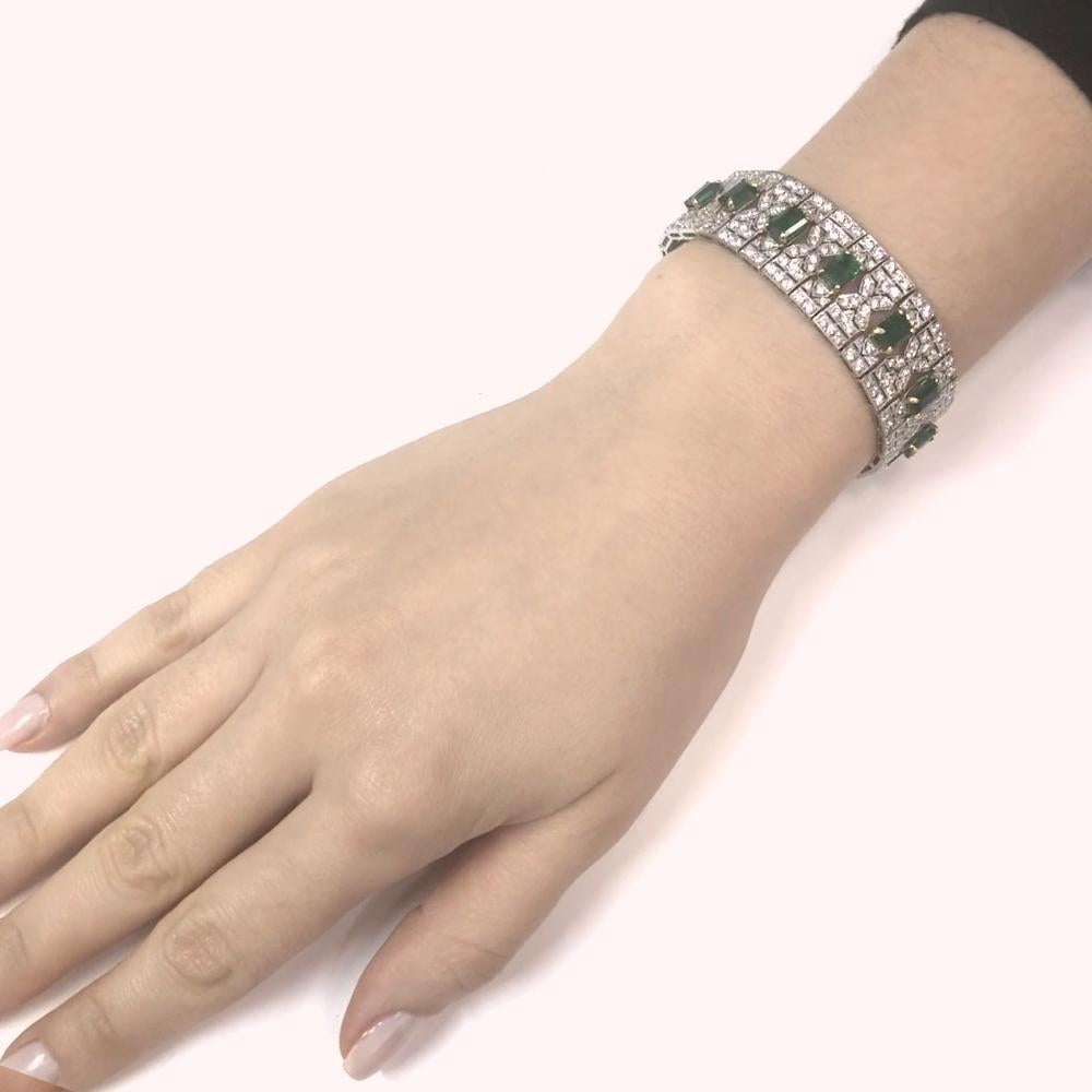 Slim vintage and Art Deco inspired diamond platinum bracelet.
Adorned with Zambian emerald cut emeralds 13.14 carat total.
Accented with white round cut diamonds 8.26 carat total.
Diamonds are all natural in G-H Color Clarity VS.
Platinum 950