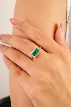Zambian Emerald & Diamond East To West Halo Engagement Ring in 14k Yellow Gold