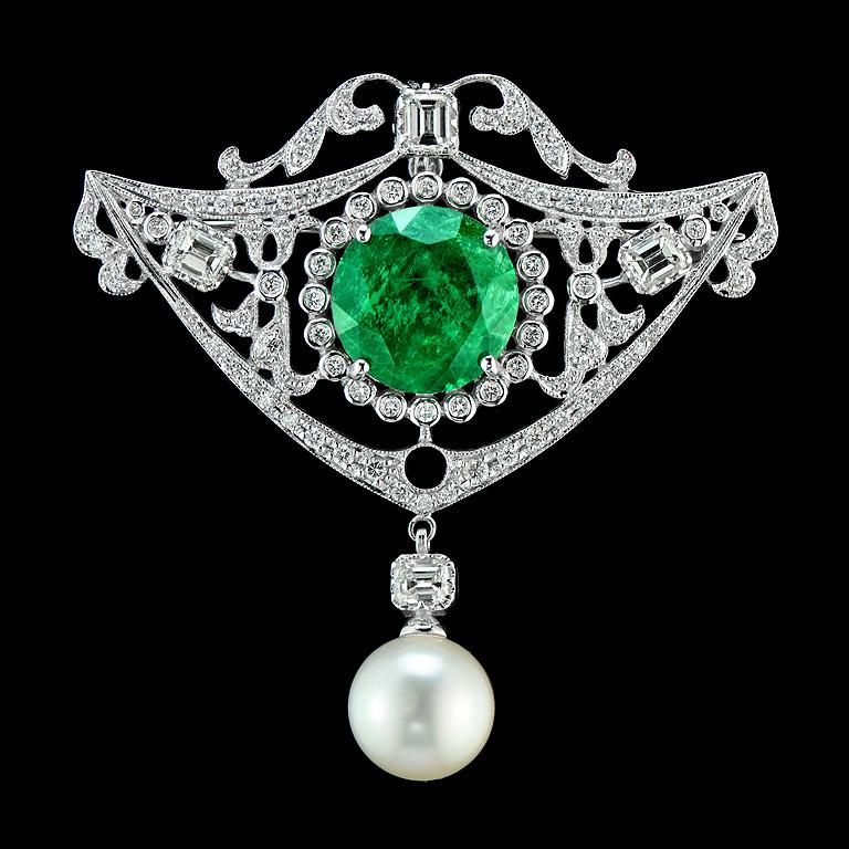 Zambian Emerald 8.88 ct.
Diamonds Emerald cut 4 pcs. 1.35 ct.
Other Diamonds 83 pcs. 83 pcs. 1.14 ct.
South Sea Pearl 9.85 ct.

This item was made in 18K White Gold and can be used as 