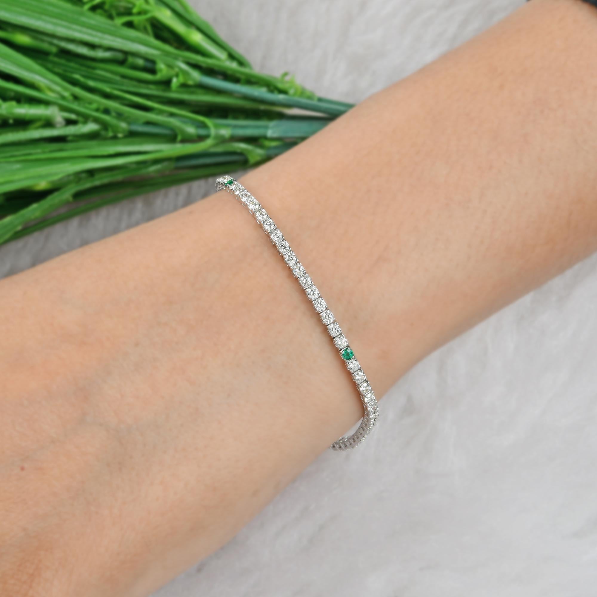 Natural Zambian Emerald Diamond Stacking Line Bracelet 18 Karat White Gold
The bracelet is a quintessential tennis bracelet. It features a continuous, flexible line of evenly sized, individually set diamonds. The stones appear to be round