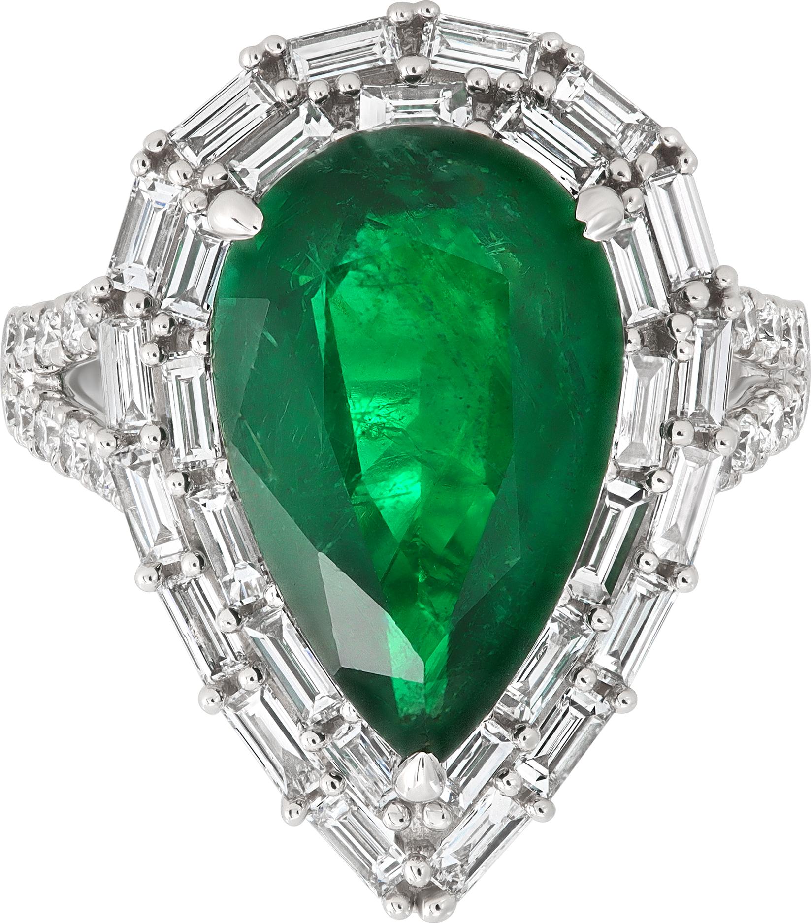 Zambian emerald & diamond ring in 18k white gold with a center pear shape cut Emerald (5.40 carats) set in 18k white gold accented with approximately 1.60 carats of round and baguette diamonds averaging G-H color, VS clarity. Size 6 1/2.

This