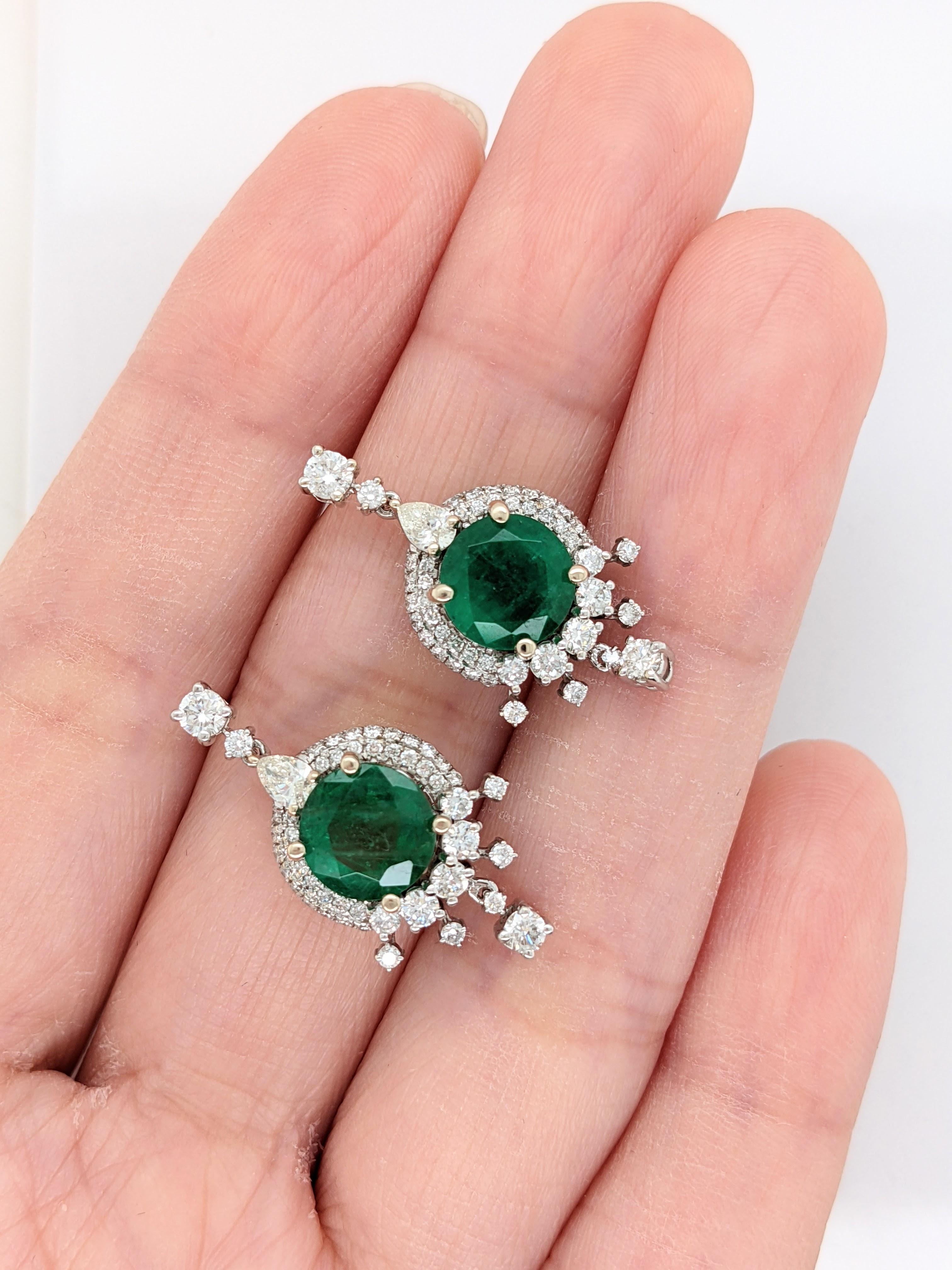 Item Type: Earring
Gold Purity: 14k
Gold weight: 5.02 grams
Diamond: 98 diamonds totaling 1.3 cts

Stone Specs:
Type: Zambian Emerald
Weight: 3.57 cts
Shape: Round
Size: 8mm
Treatment: Oiled
Hardness: 7.5-8
Origin: Zambia


These earrings are made