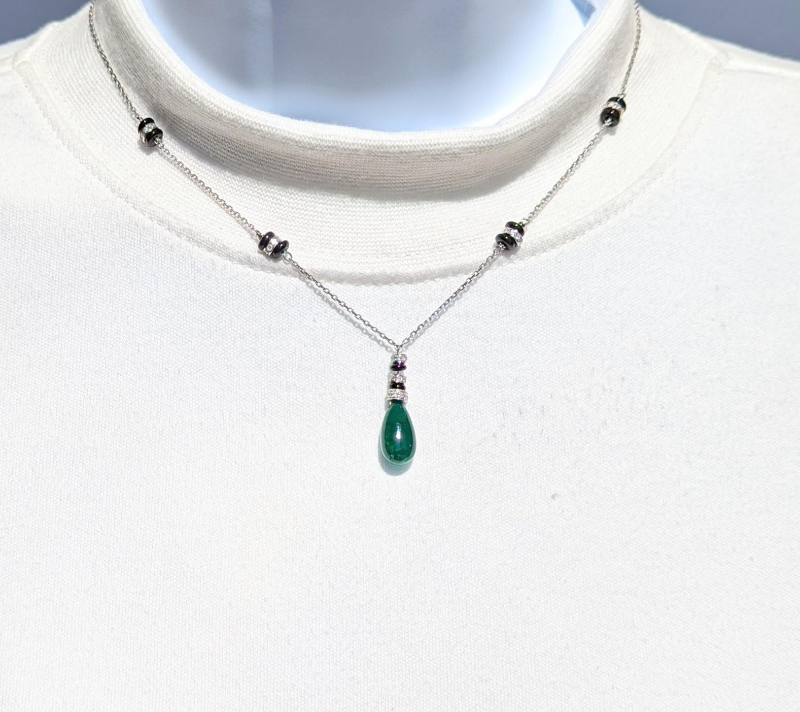 Beautiful Zambian emerald drop with good quality, white, and bright diamond rounds.  Handmade in 18k white gold.  Length is 16