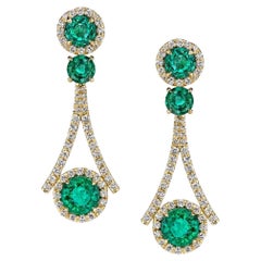 18K yellow gold, round-cut Zambian Emerald Earrings. 7.19 carats.