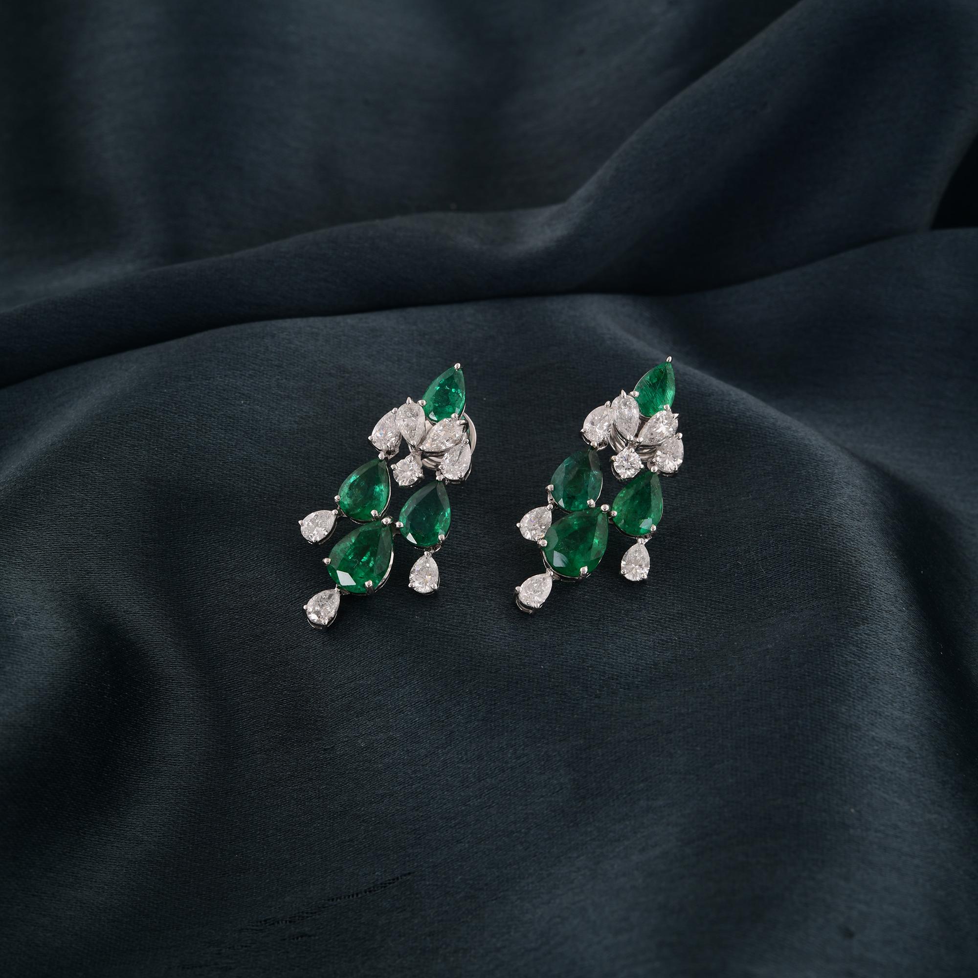 Indulge in the captivating allure of these exquisite Zambian Emerald Gemstone Earrings, a testament to timeless elegance and unparalleled craftsmanship. Crafted with the utmost precision and care, these earrings boast a pair of lush, verdant Zambian