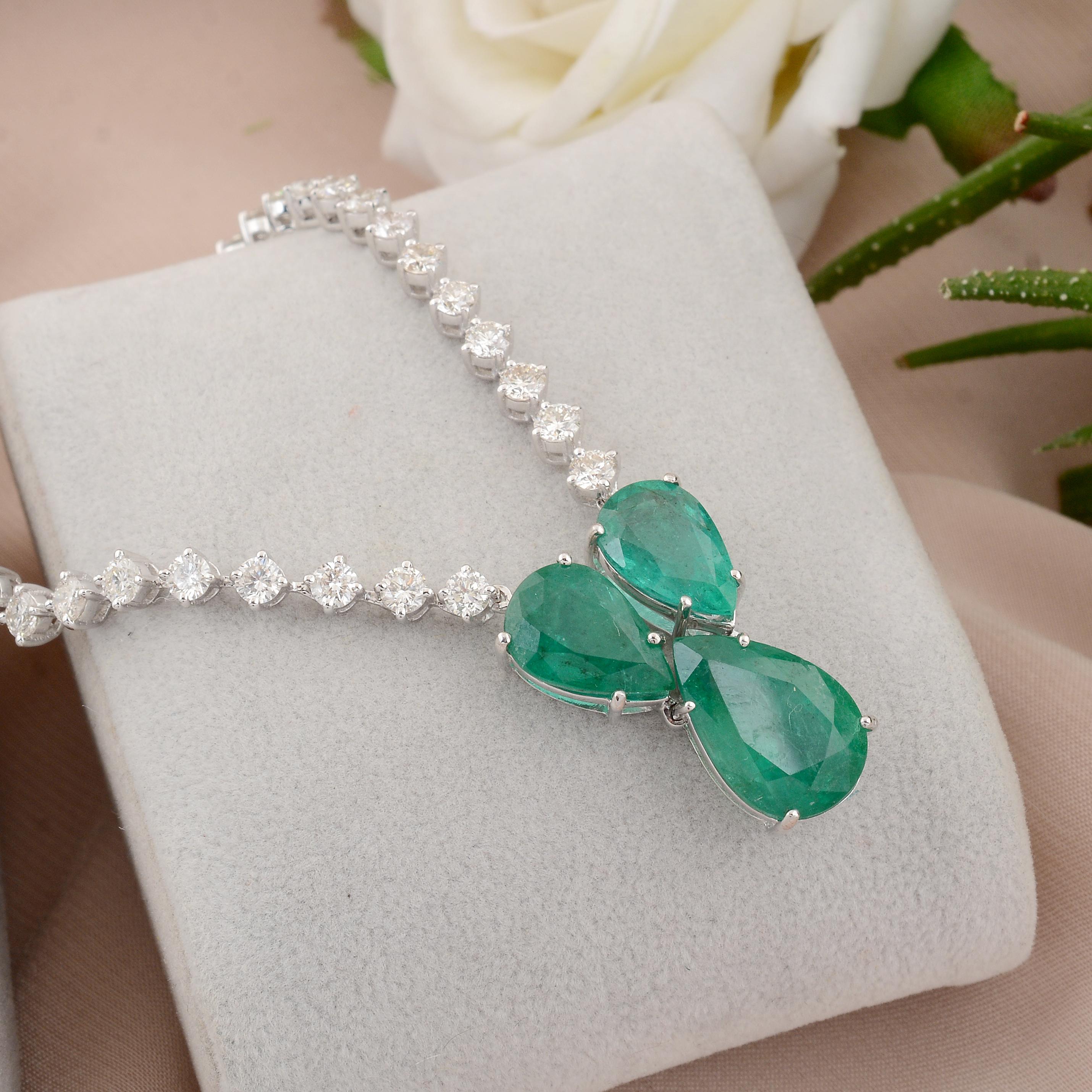 A charm necklace featuring a Zambian emerald gemstone and diamonds in 14 karat white gold is a stunning and elegant piece of fine jewelry. The necklace typically showcases a Zambian emerald as the central charm or pendant element, complemented by