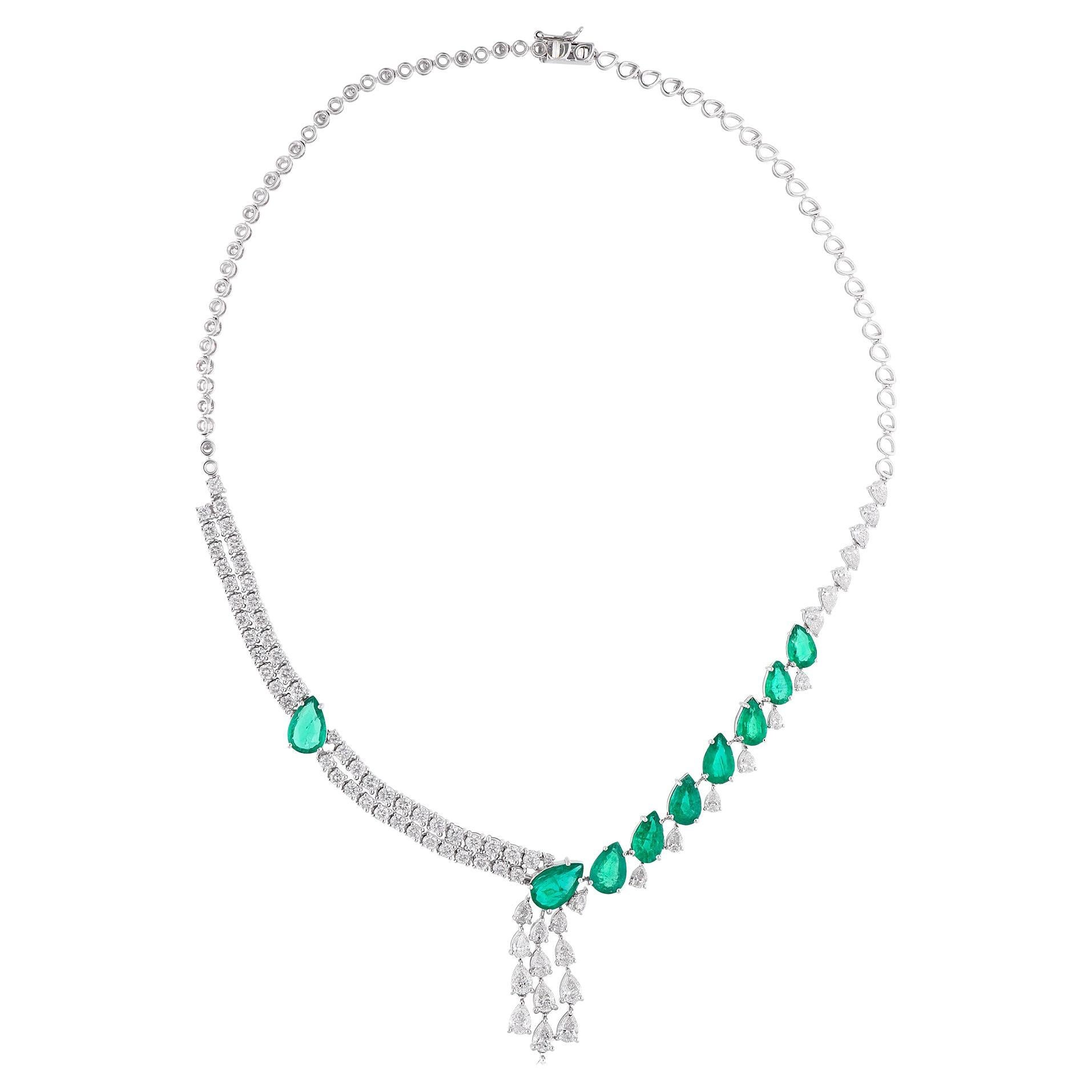 Enhancing the emerald are sparkling diamonds, meticulously set in 18 karat white gold. The diamonds add a touch of brilliance and glamour to the necklace, complementing the radiant green of the emerald. The precise setting of the diamonds showcases