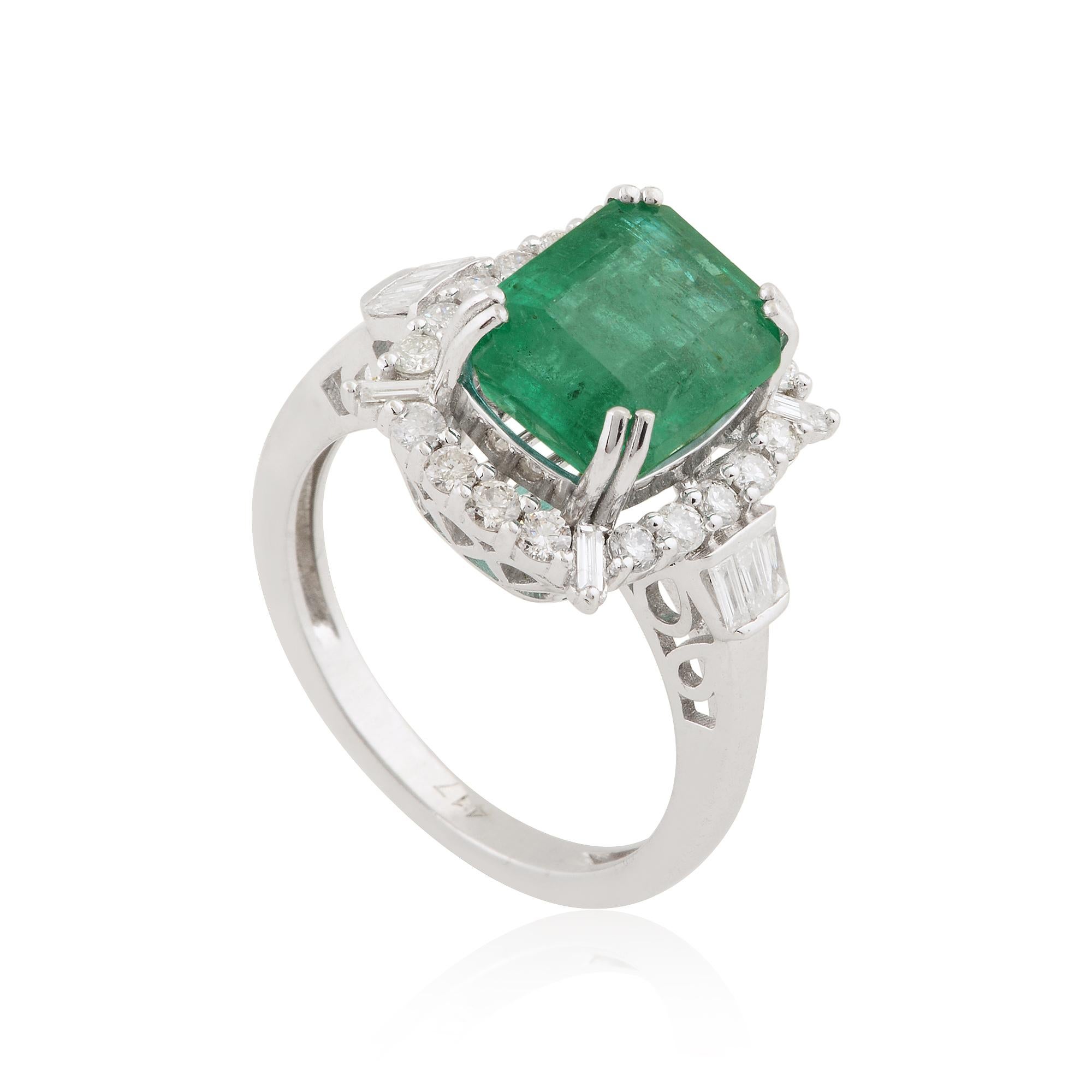 Introducing the epitome of elegance and luxury: the Zambian Emerald Gemstone Cocktail Fine Ring adorned with Baguette Diamonds, meticulously crafted in exquisite 10 Karat White Gold. This captivating ring is a true masterpiece of fine jewelry,