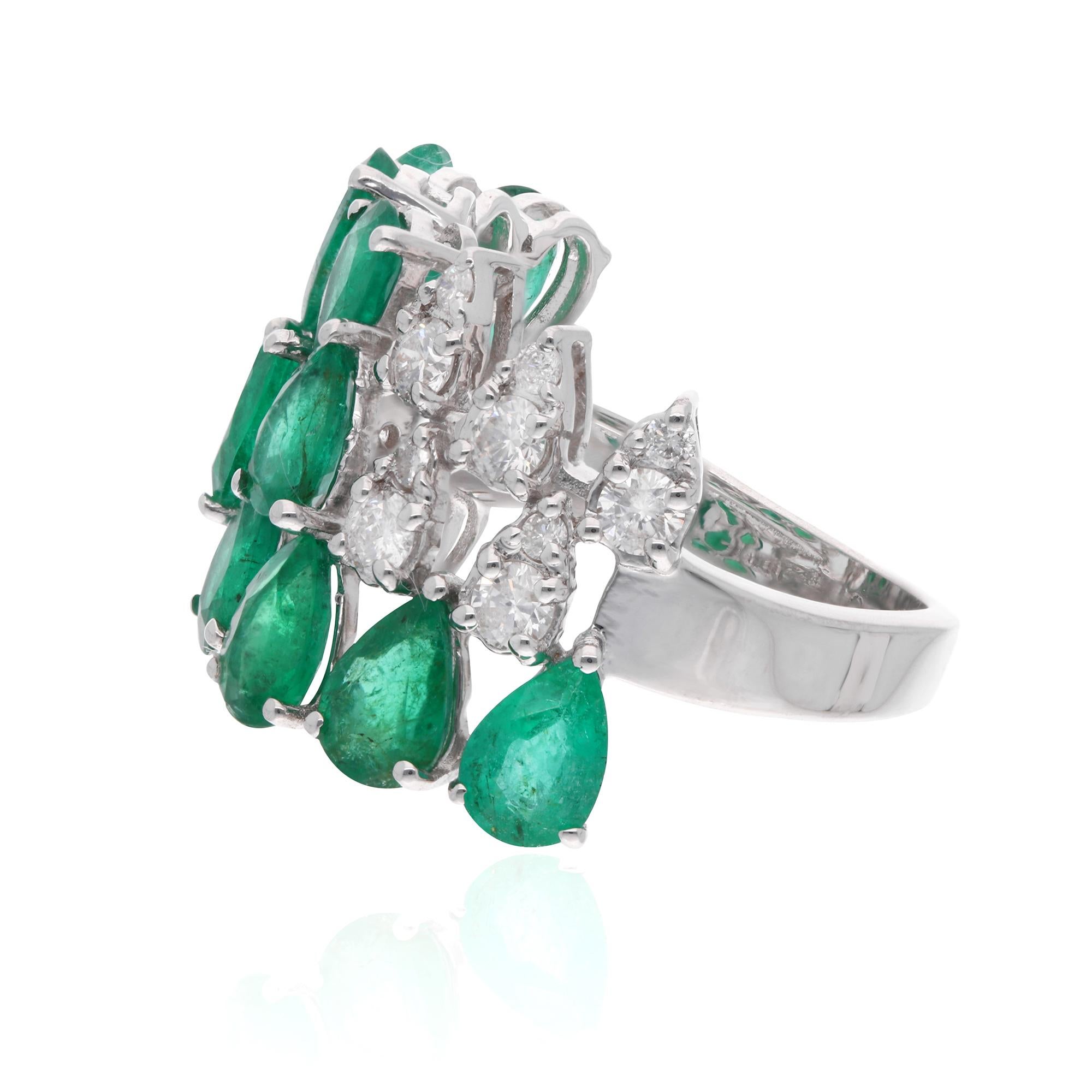 At the heart of this enchanting ring lies a magnificent Zambian Emerald gemstone, renowned for its rich green hue and unparalleled beauty. Sourced from the depths of Zambia's emerald mines, each stone is meticulously selected for its exceptional
