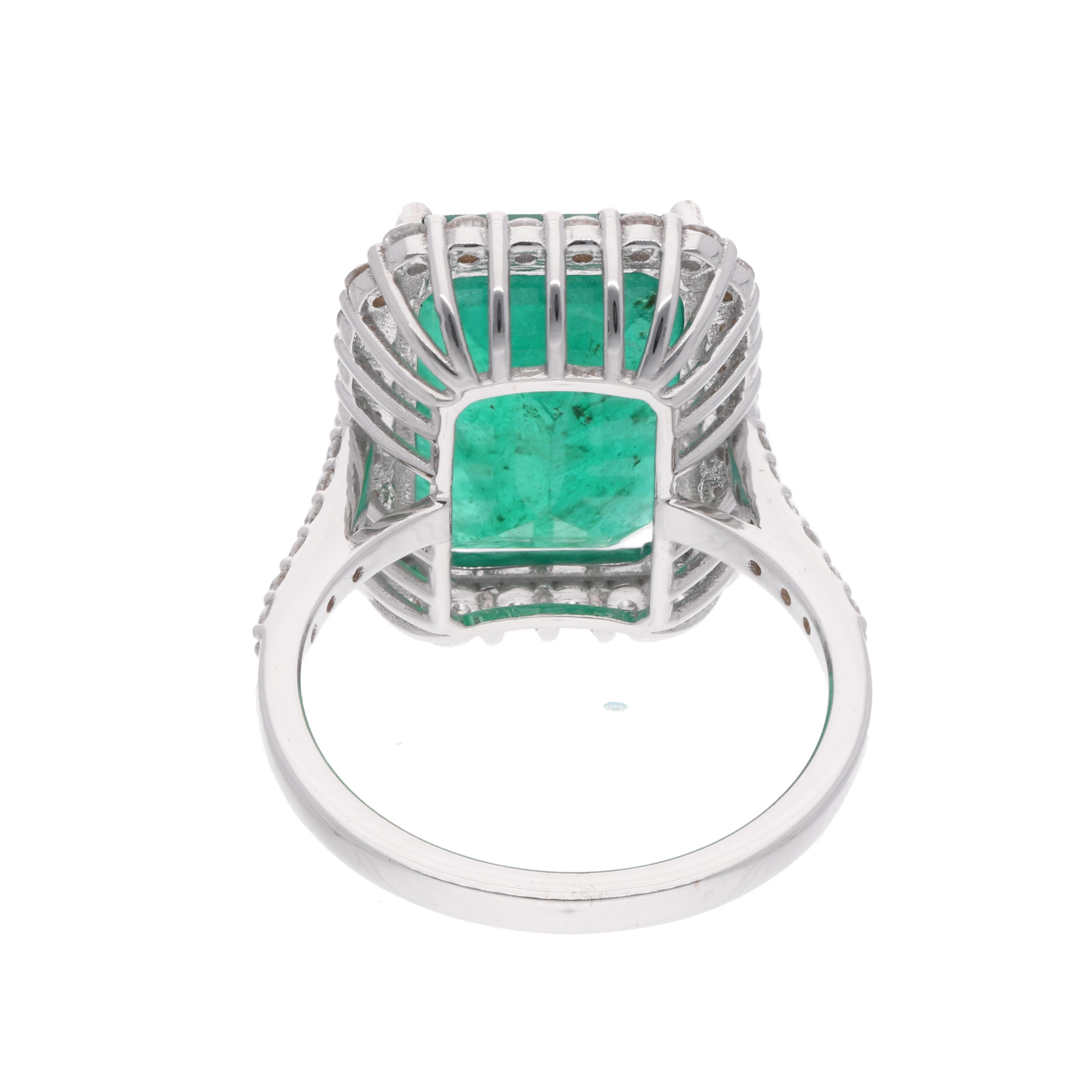 Handcrafted with care and precision, this ring features a stunning 10.53 ct. Emerald Cut Zambian Emerald at its center, surrounded by halo of sparkling diamonds. This ring is available in 18k Rose Gold/White Gold/Yellow Gold.

This is a perfect Gift