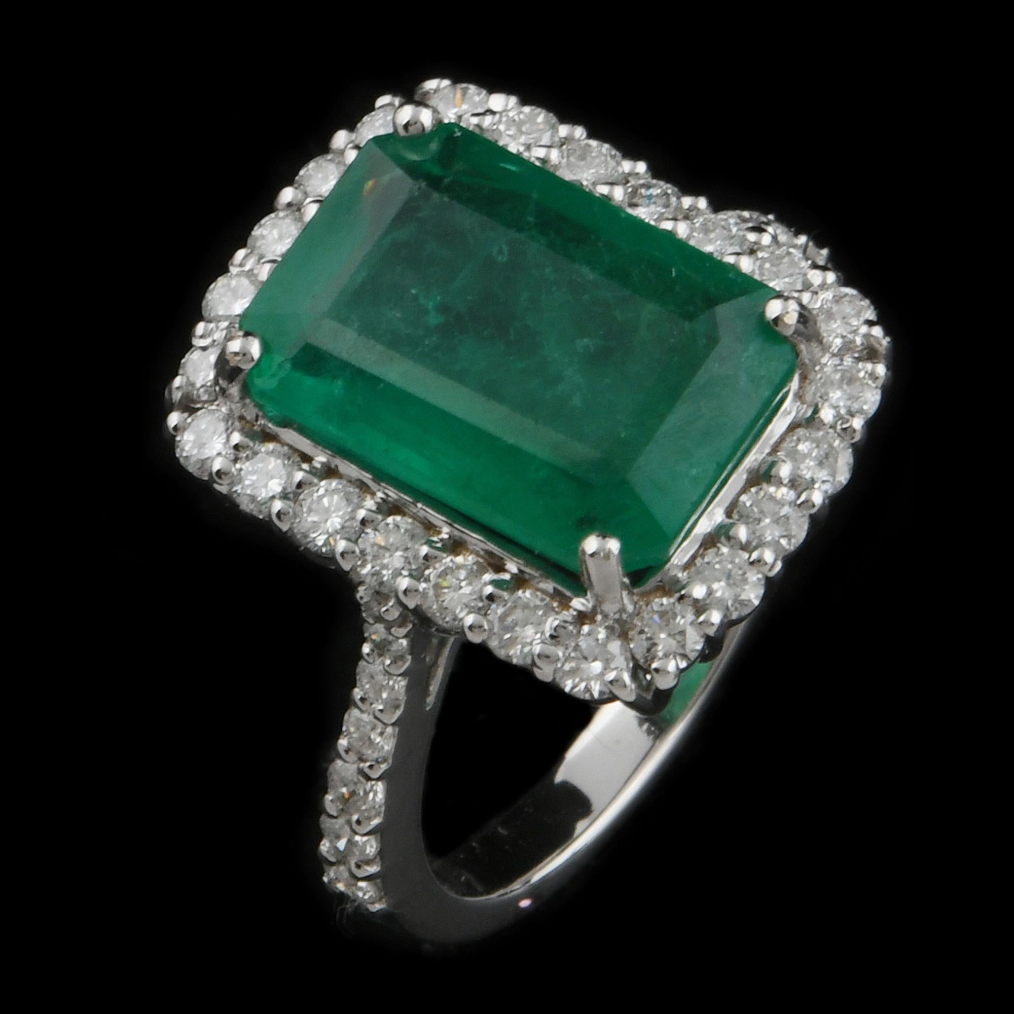 Handcrafted with care and precision, this ring features a stunning 5.02 ct. Emerald Cut Zambian Emerald at its center, surrounded by halo of sparkling diamonds. This ring is available in 18k Rose Gold/White Gold/Yellow Gold.

This is a perfect Gift