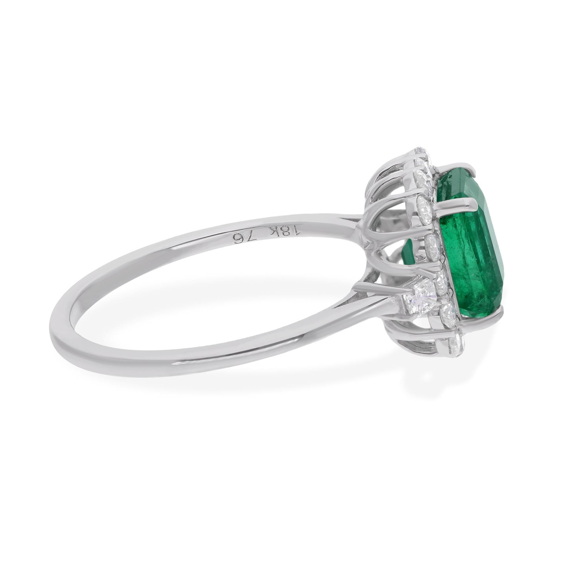 At its heart lies a stunning Zambian Emerald, renowned for its exceptional clarity and rich, verdant hue. Mined from the depths of Zambia's renowned emerald mines, this gemstone exudes a natural allure, evoking visions of lush landscapes and
