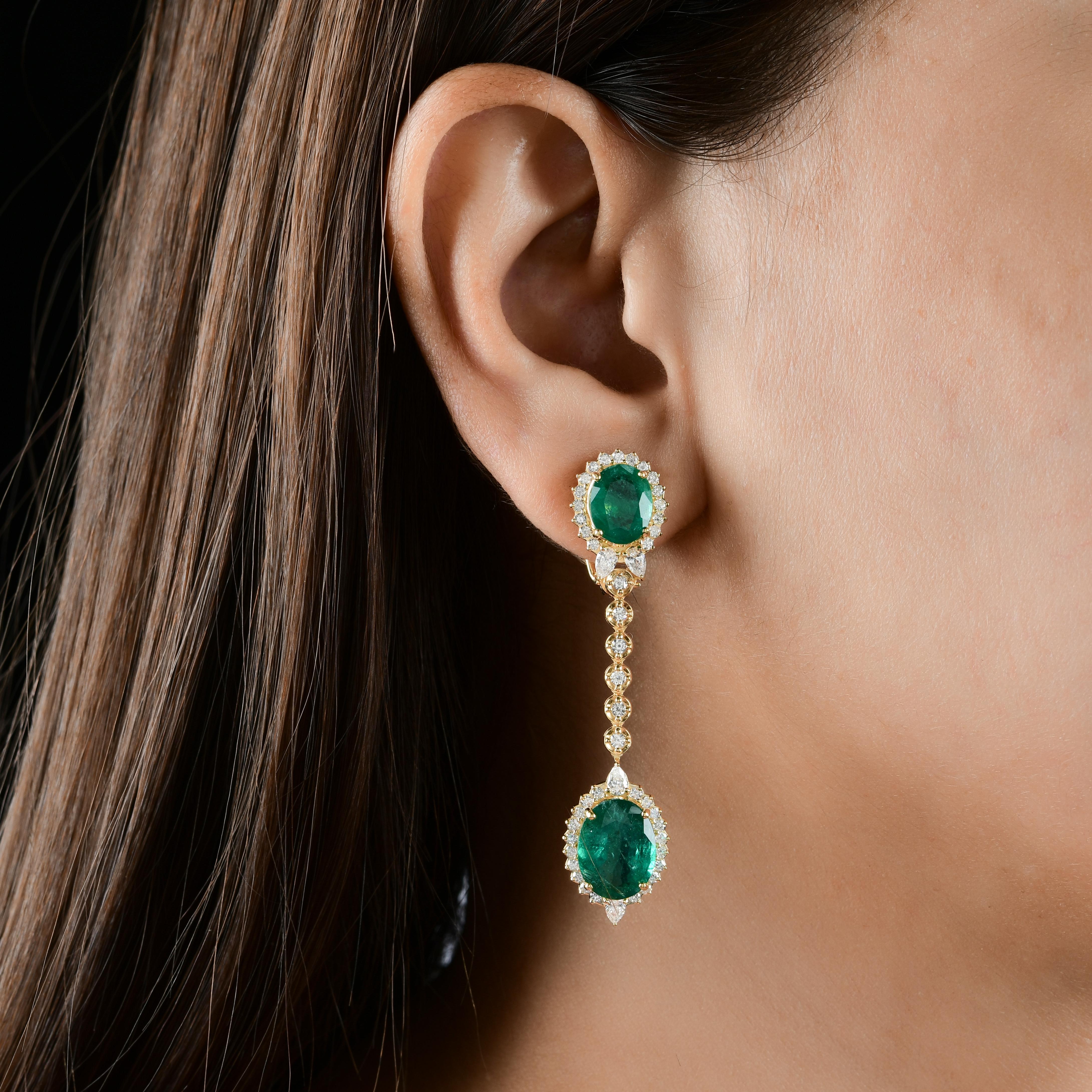 Surrounding the emeralds are sparkling diamonds, adding a touch of glamour and brilliance to the design. These diamonds are of the highest quality, meticulously set to maximize their fire and brilliance, creating a dazzling halo that accentuates the