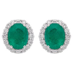 Clous d'oreilles en or blanc 14 carats avec émeraudes de Zambie et diamants baguettes