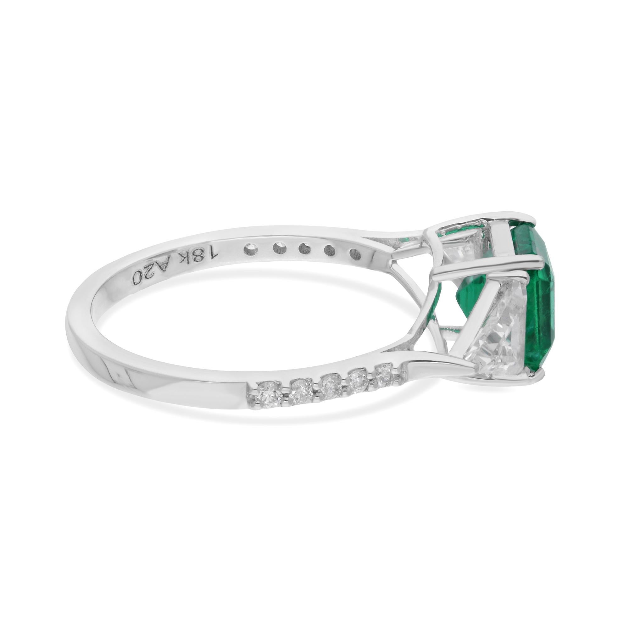 At the heart of the ring lies a mesmerizing Zambian emerald gemstone, renowned for its vibrant green hue and exceptional clarity. The emerald exudes a sense of natural allure and luxury, capturing the eye with its radiant presence. Surrounding the