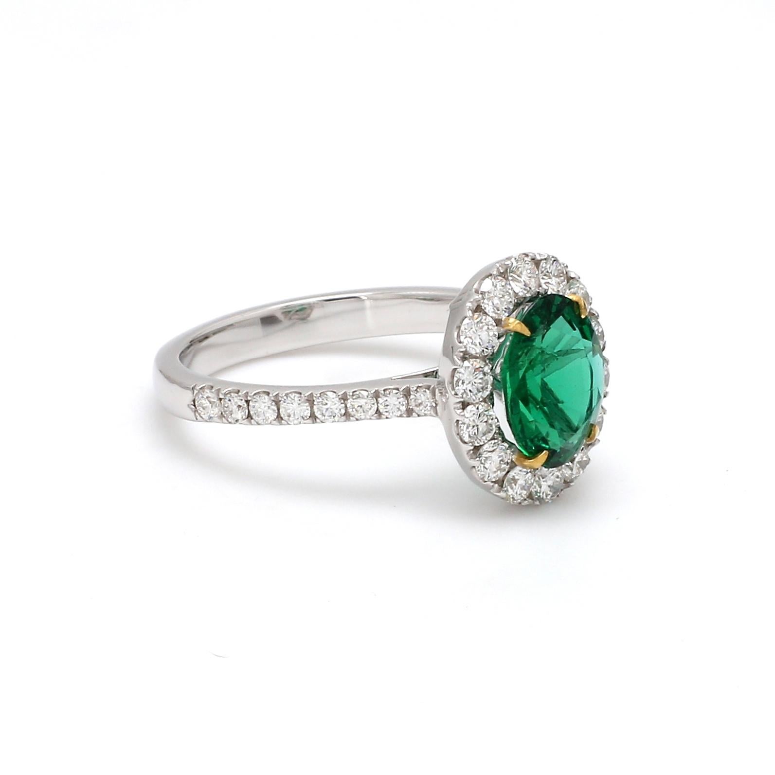 A Beautiful Handcrafted Ring in 18 karat Gold with Natural Emerald of Zambian origin and Brilliant Cut Colorless Diamonds in Halo.

Emerald Details
Weight: 1.420 carats
Natural Emerald Stone with No Treatment To Enhance Appearance.
Origin :